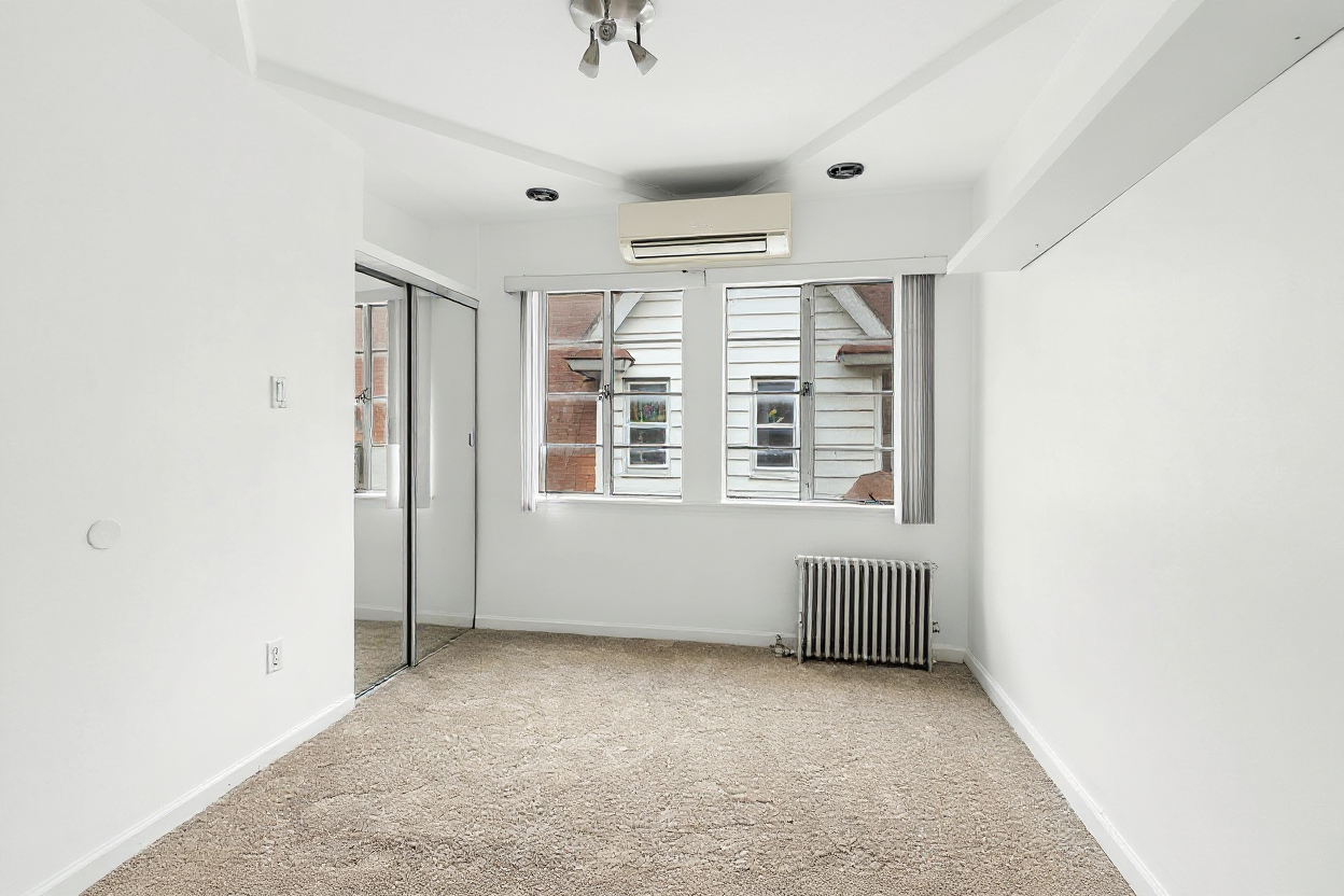 1070 East 13th Street Brooklyn, NY 11230 - Photo 15 of 18 an empty room with windows
