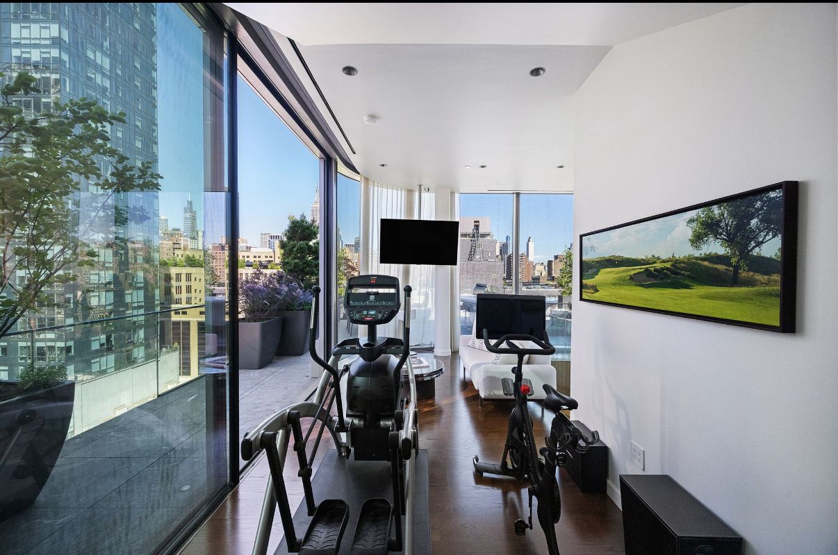 520 West 28th Street, Unit PH37 Manhattan, NY 10001 - Photo 22 of 45 a view of a dining room with furniture and a flat screen tv
