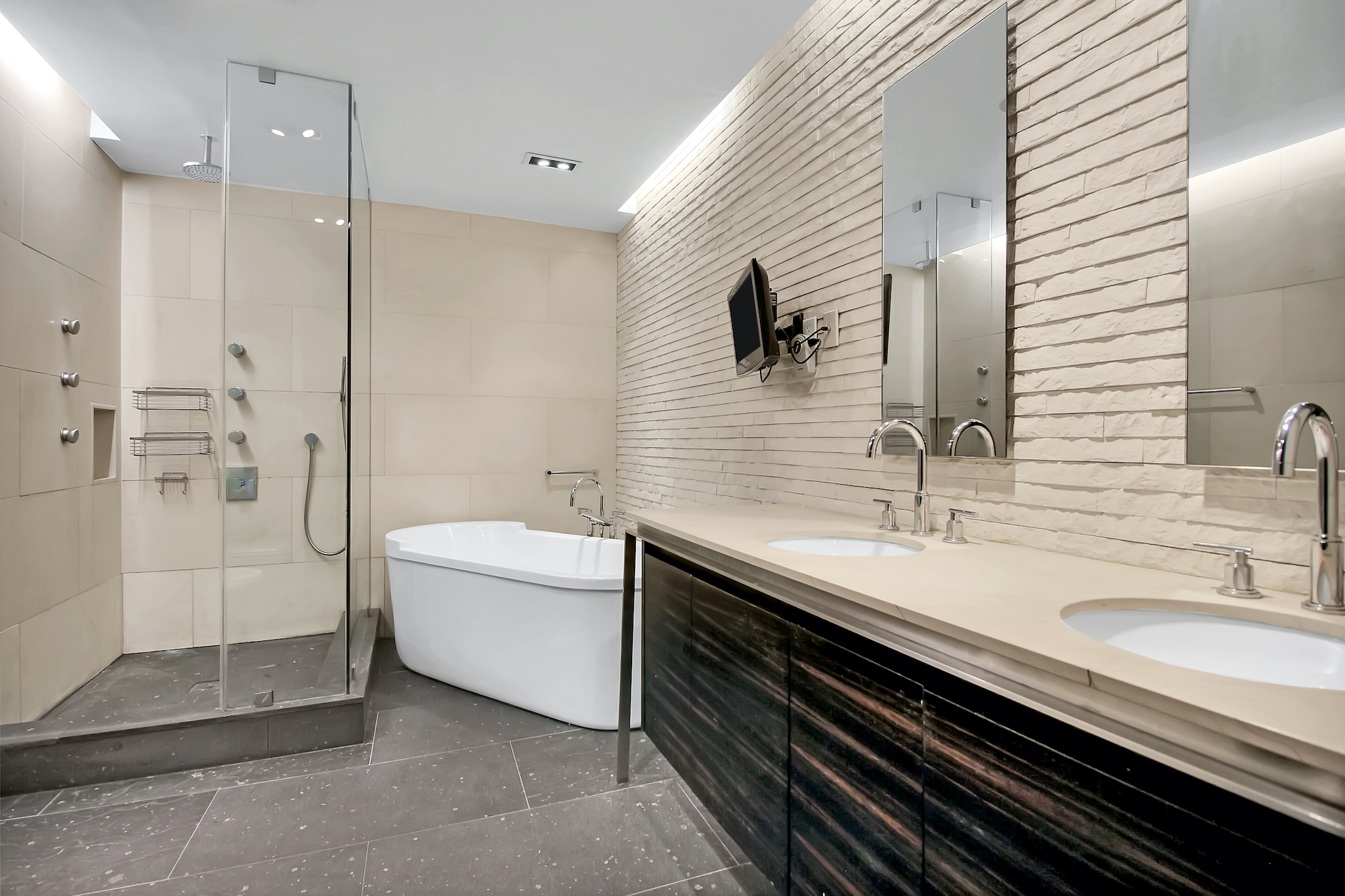 405 Broadway, Unit 3 Manhattan, NY 10013 - Photo 7 of 11 a bathroom with a granite countertop sink a toilet a mirror and shower