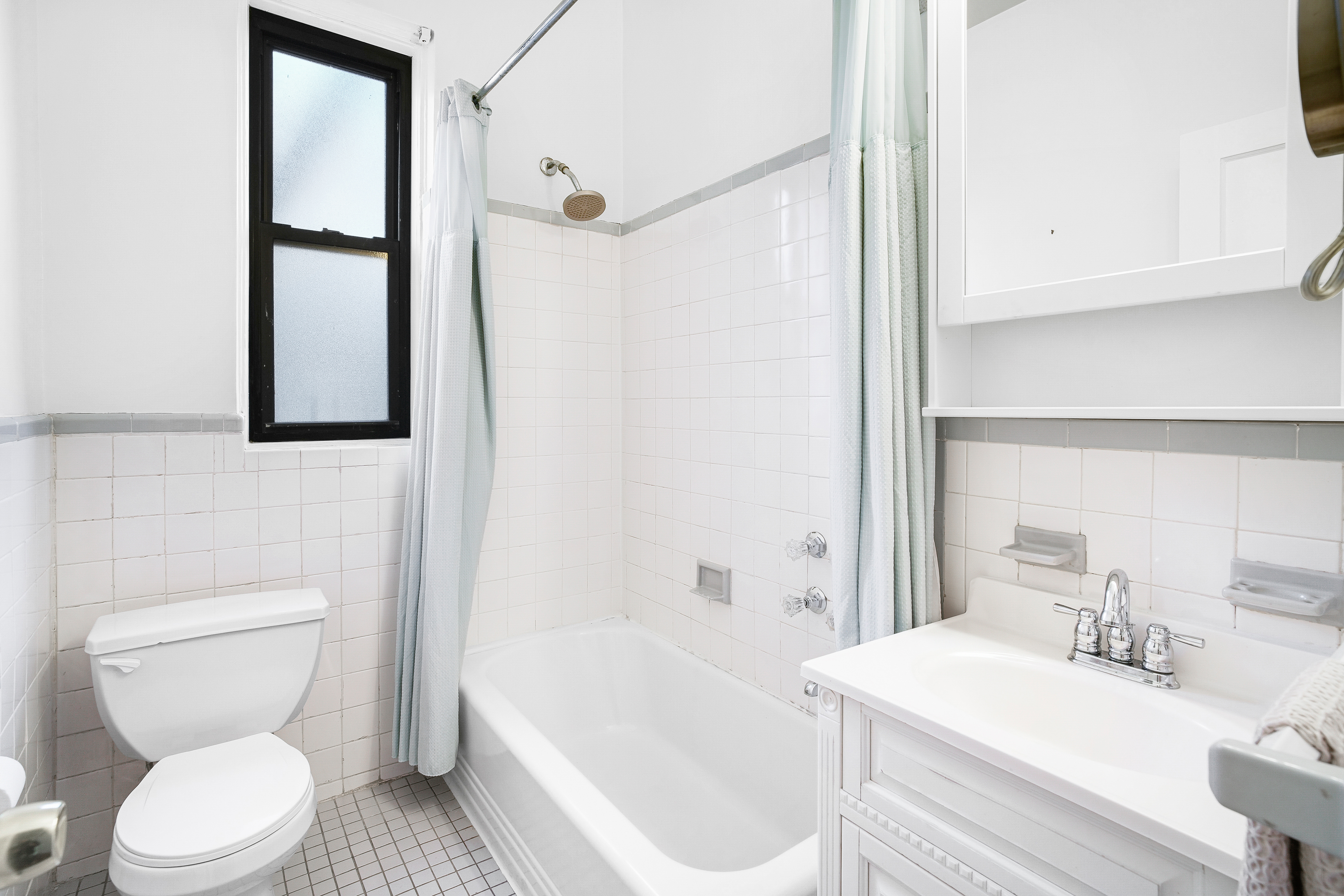 215 West 105th Street, Unit 5DPH Manhattan, NY 10025 - Photo 8 of 16 a bathroom with a sink toilet and shower