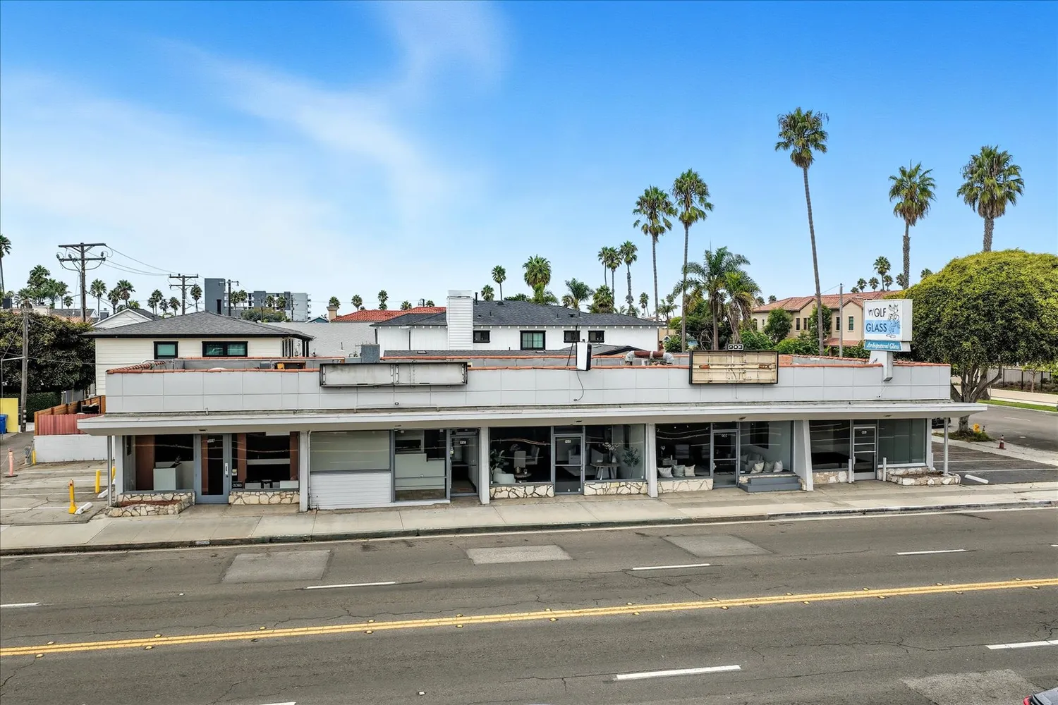a view of a street with a building in the background