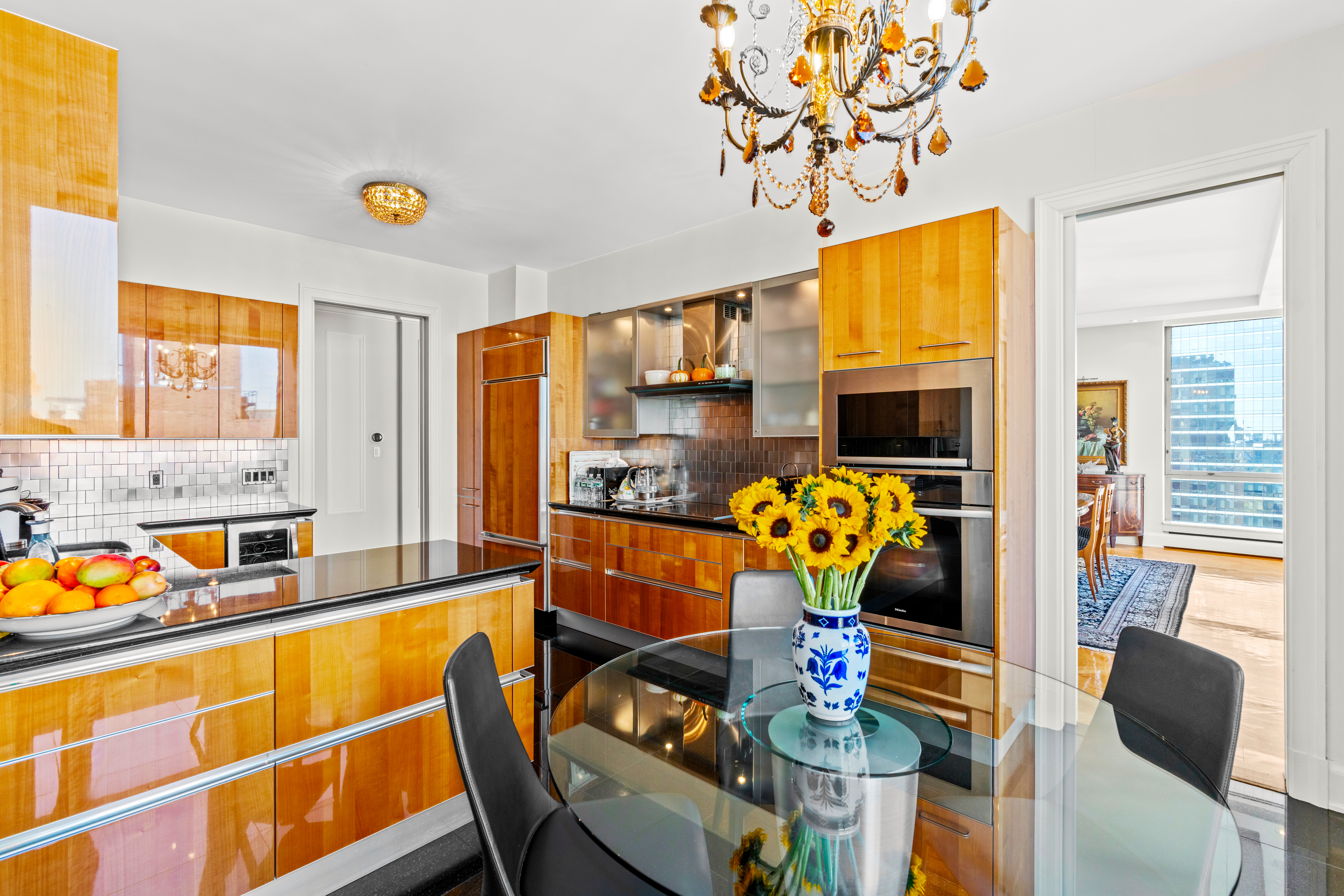 1965 Broadway, Unit 26EF Manhattan, NY 10023 - Photo 11 of 32 a dining room filled counter top space and furniture
