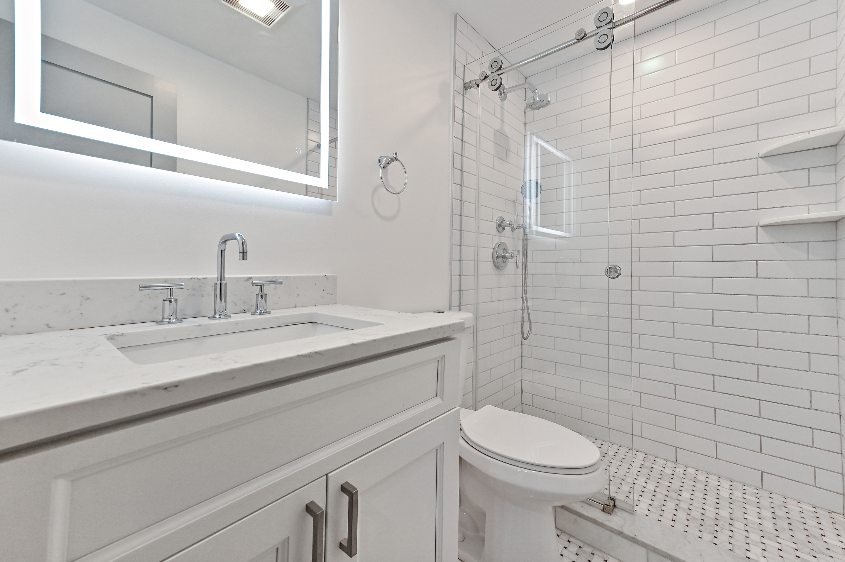 5823 Fieldston Road, Unit 1A Bronx, NY 10471 - Photo 18 of 26 a bathroom with a sink a toilet and shower