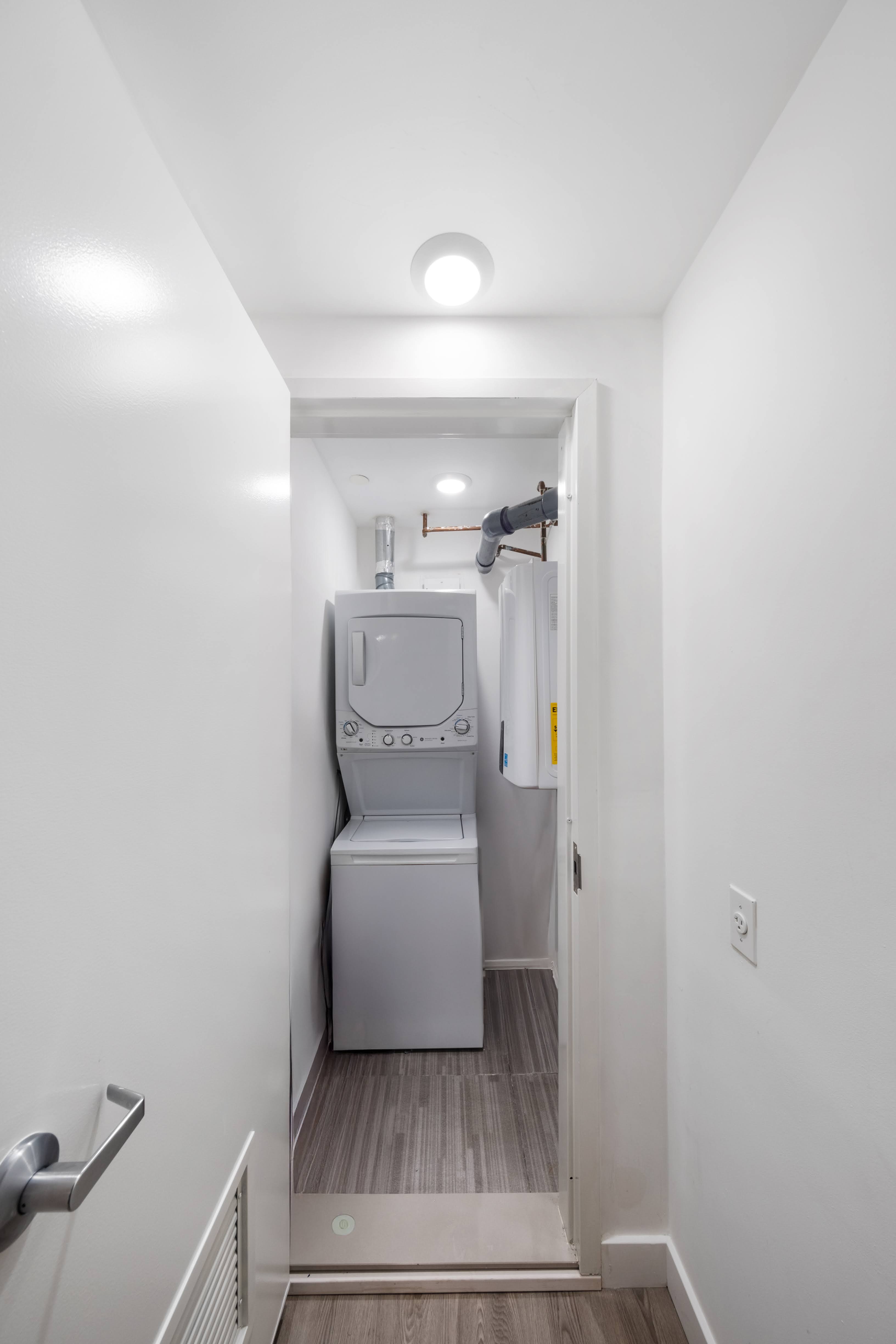2025 Ocean Avenue, Unit 1B Brooklyn, NY 11230 - Photo 6 of 10 a utility room with dryer and washer