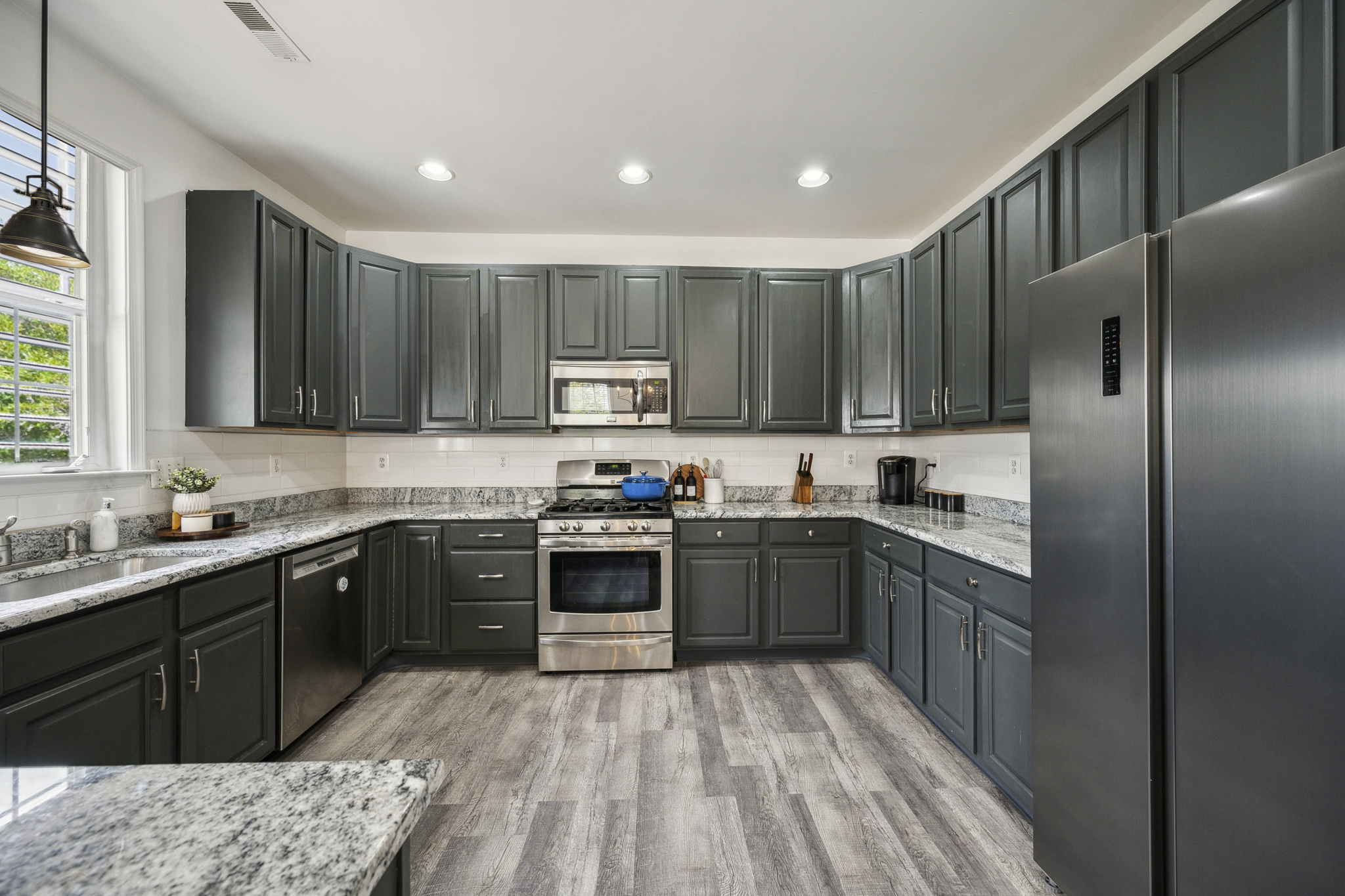 127 Hartman Road Pottstown, PA 19465 - Photo 9 of 42 a kitchen with stainless steel appliances granite countertop a sink stove refrigerator and cabinets