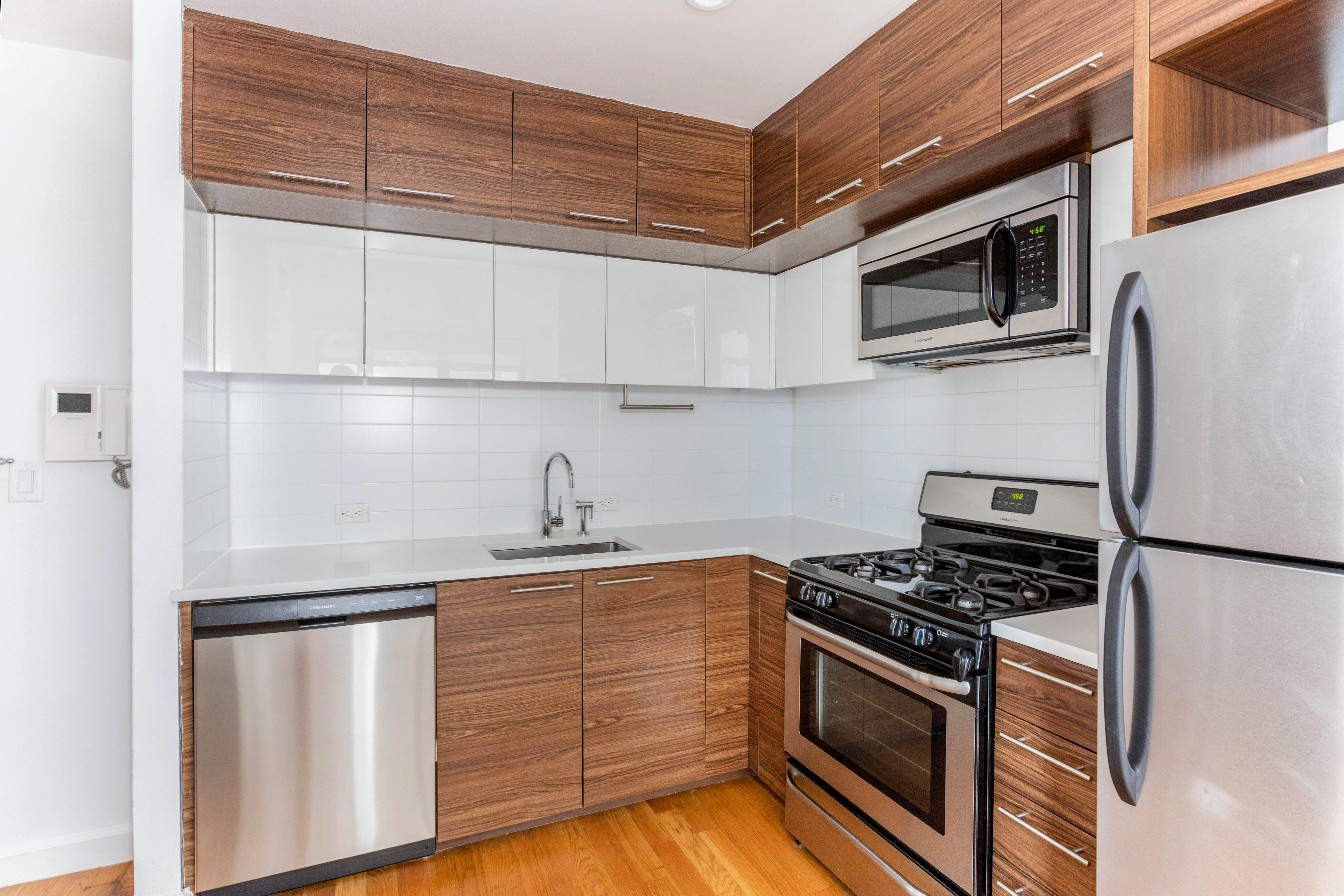 267 6th Street, Unit 5H Brooklyn, NY 11215 - Photo 3 of 15 a kitchen with stainless steel appliances granite countertop a sink stove and refrigerator
