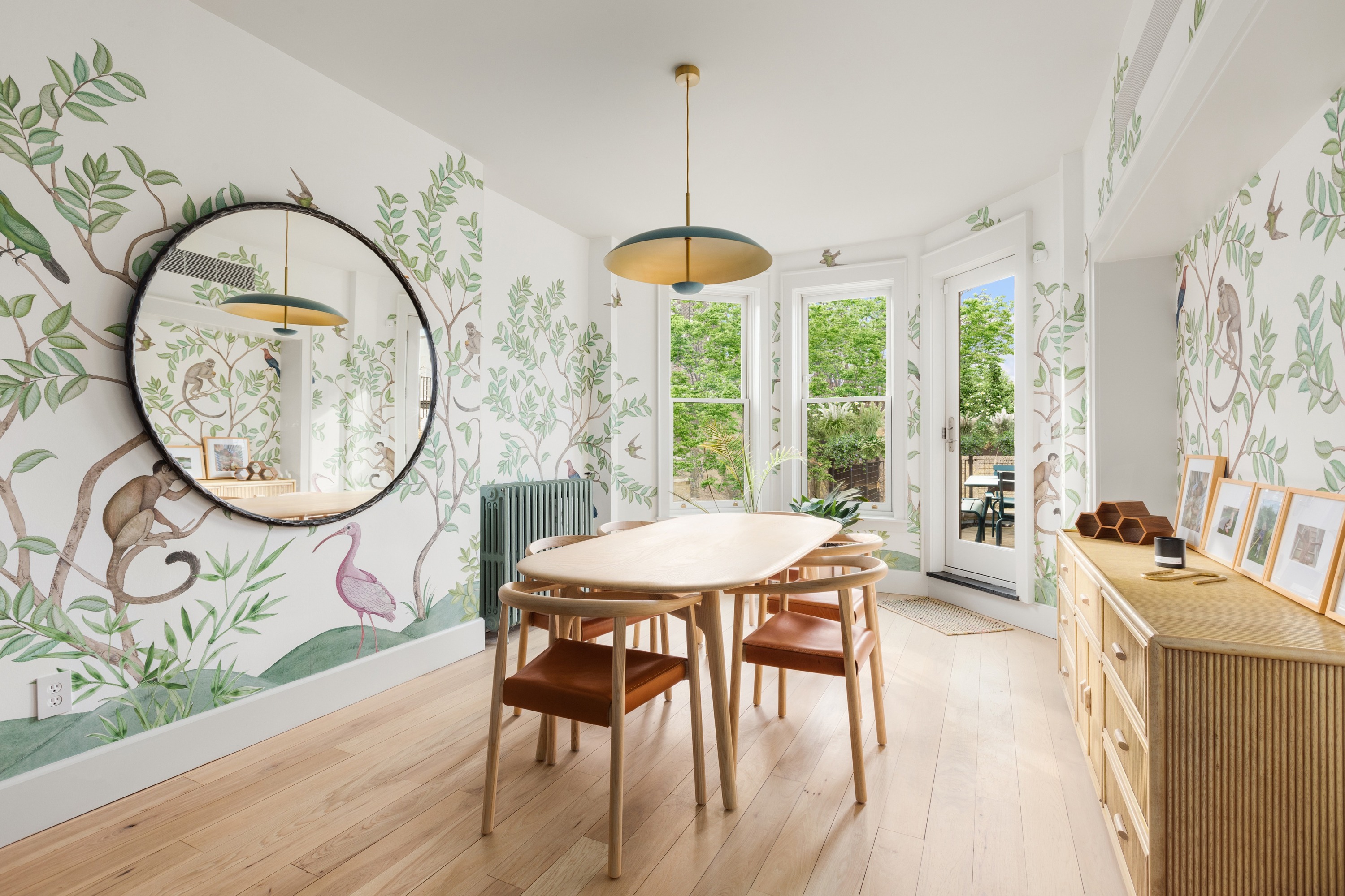152 Underhill Avenue Brooklyn, NY 11238 - Photo 6 of 20 a dining room with wooden floor a chandelier a wooden table and chairs