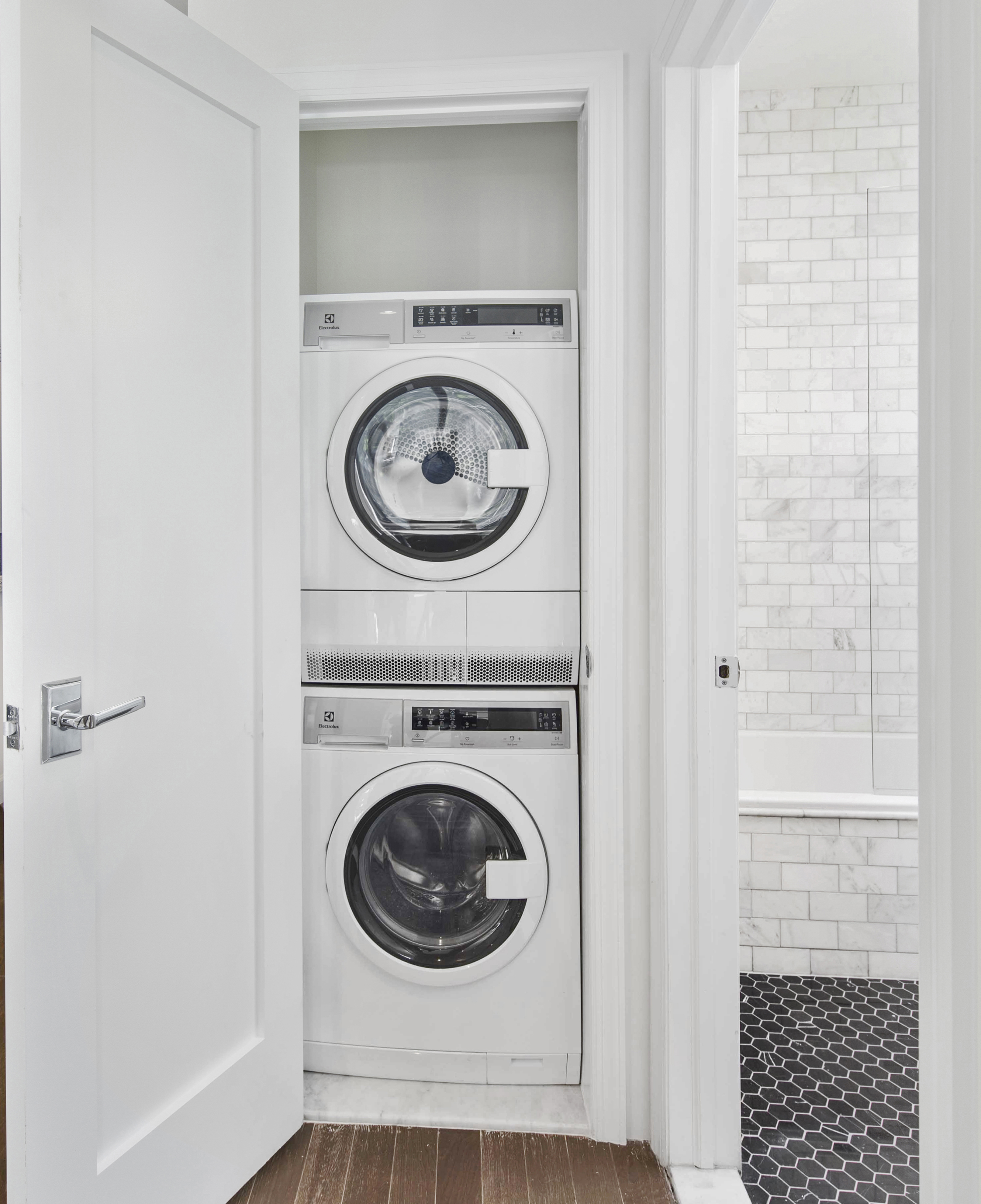 44 East End Avenue, Unit 3C Manhattan, NY 10028 - Photo 7 of 13 a view of a hallway with washer and dryer