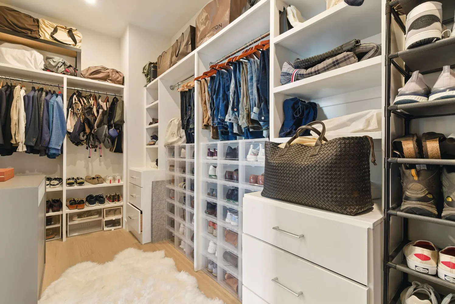 a large bedroom with a bed and large window