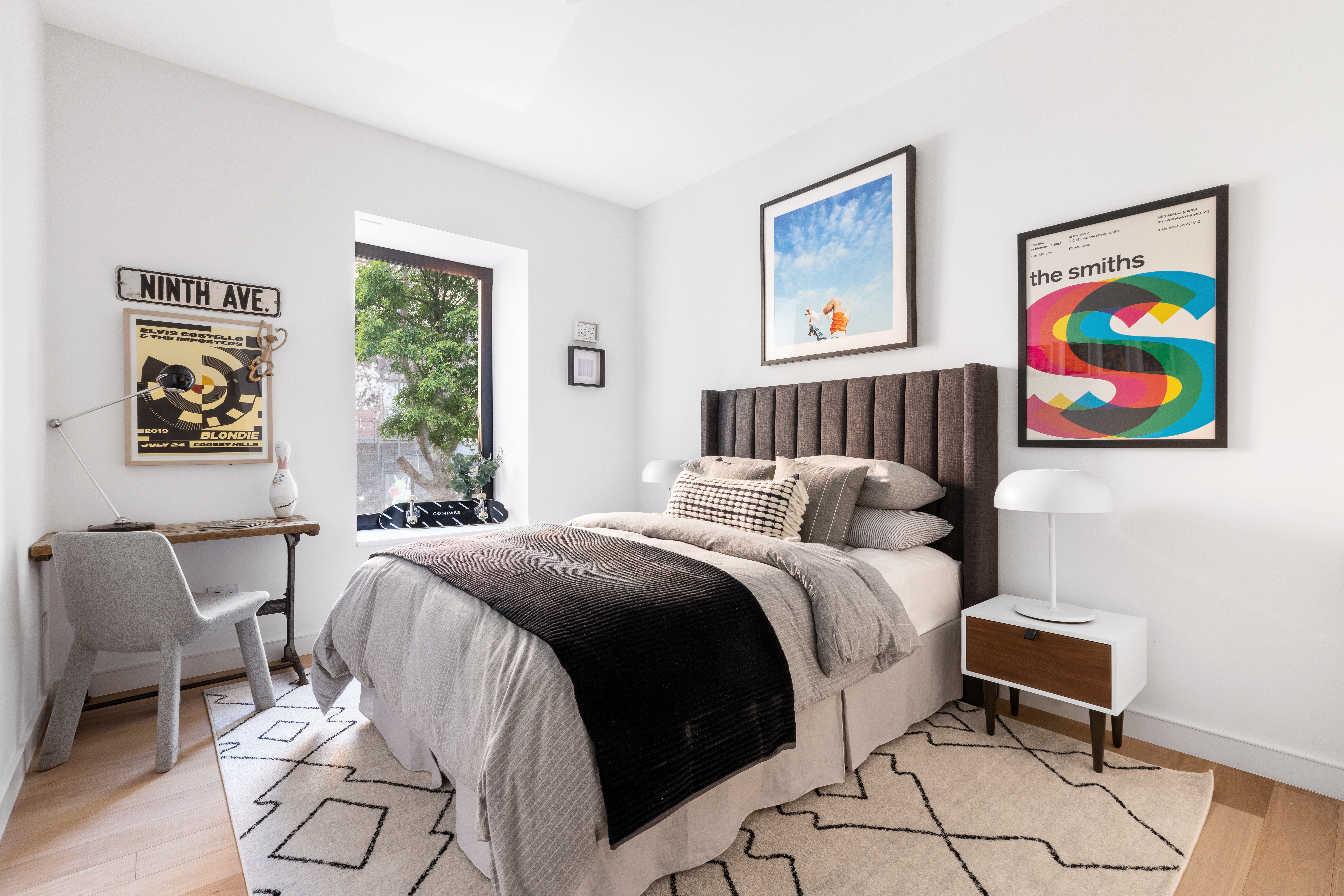 500 West 22nd Street, Unit 2A Manhattan, NY 10011 - Photo 12 of 19 a bedroom with a bed and a painting on the wall