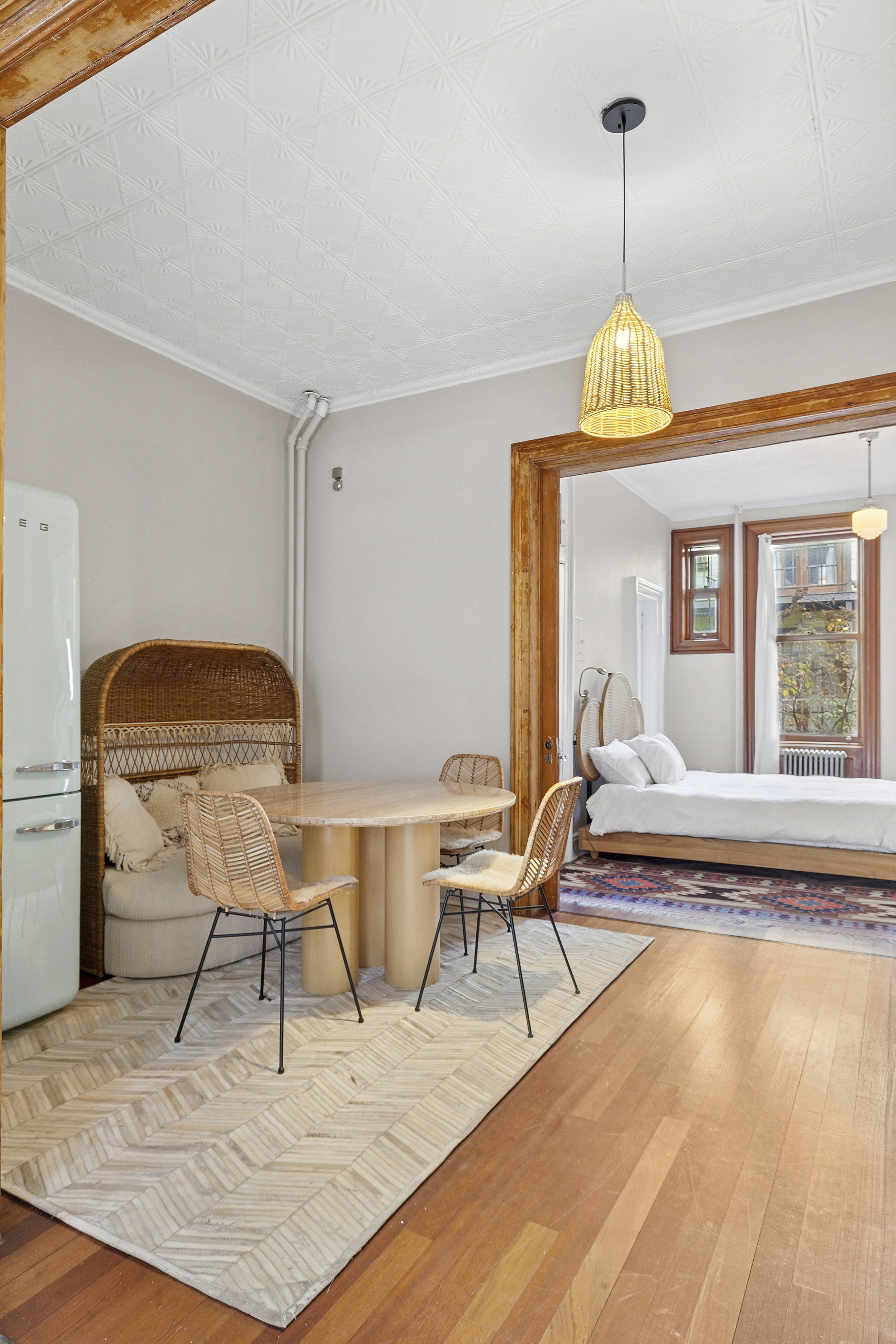 111 North 8th Street, Unit 1 Brooklyn, NY 11249 - Photo 2 of 5 a living room with dining table and a wooden floor