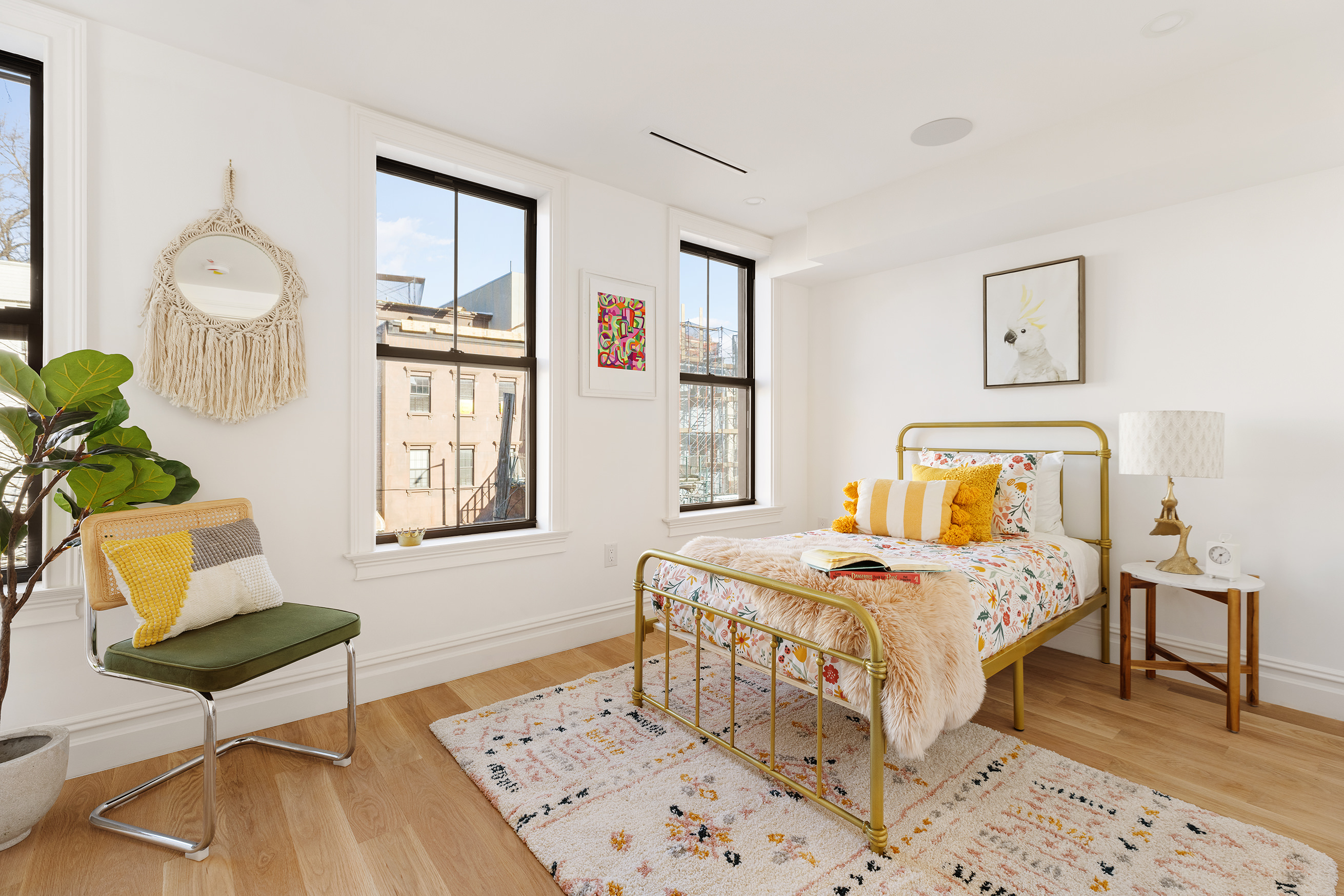 90 Putnam Avenue Brooklyn, NY 11238 - Photo 11 of 15 a bedroom that has a bed and a table in it