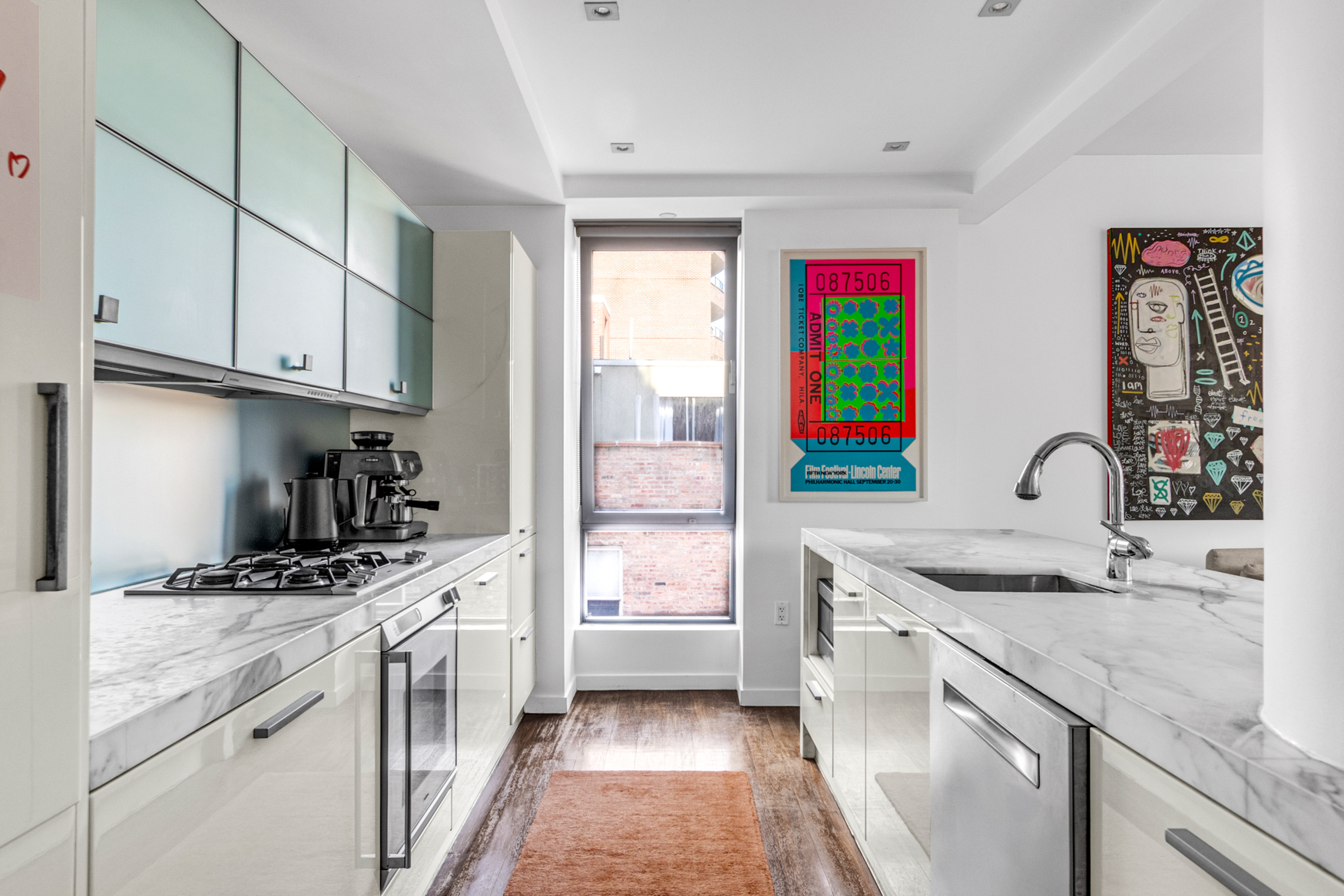444 West 19th Street, Unit 701 Manhattan, NY 10011 - Photo 3 of 11 a kitchen with stainless steel appliances granite countertop a sink stove and refrigerator