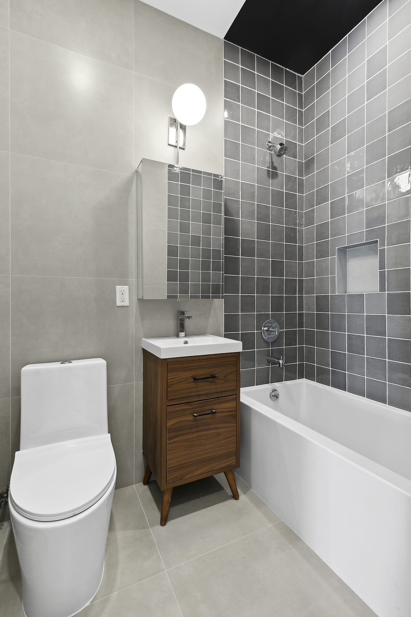 138 Schaefer Street, Unit 3A Brooklyn, NY 11207 - Photo 9 of 12 a bathroom with a sink a toilet and bathtub