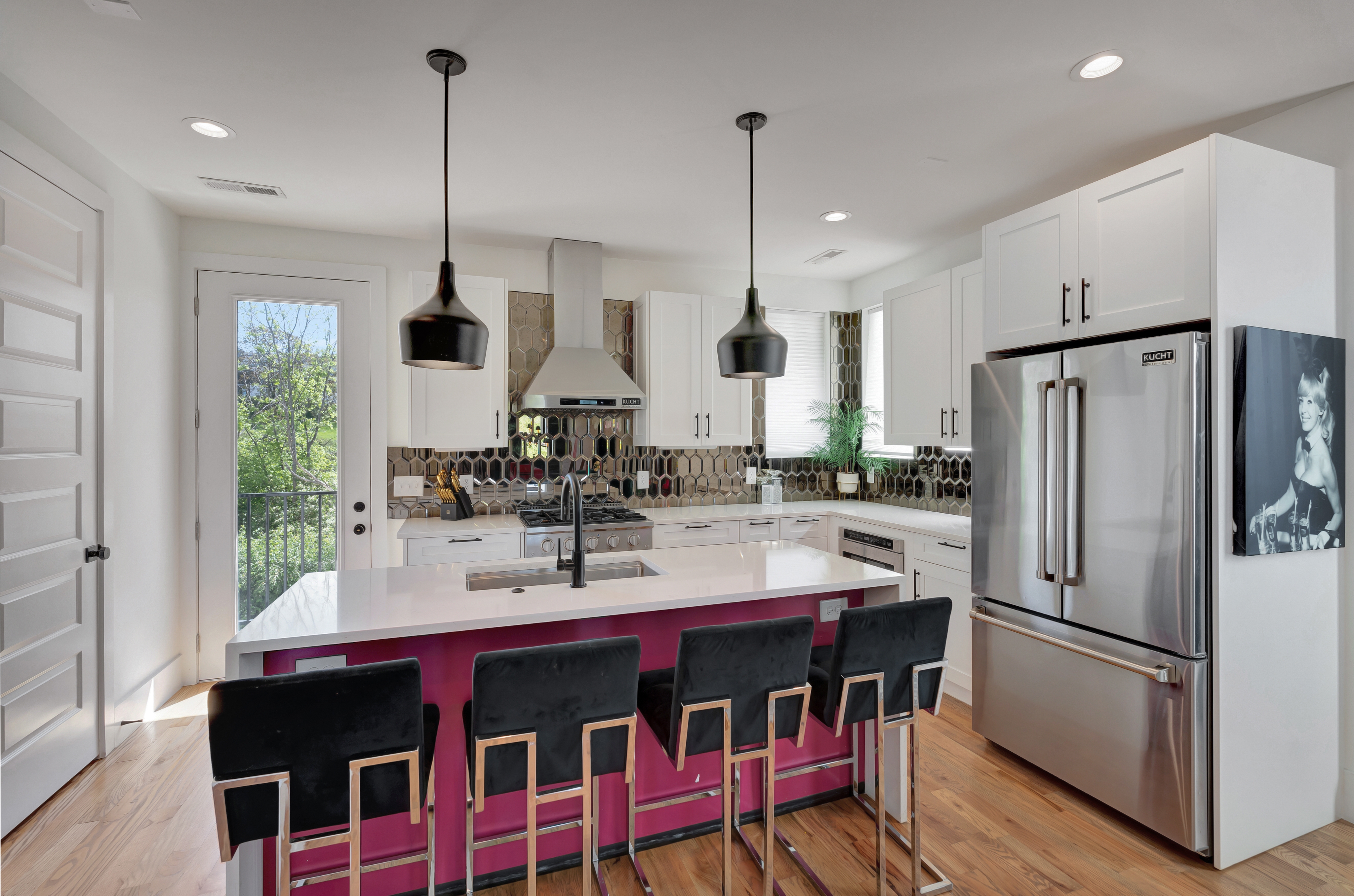1203 Brick Church Pike Nashville, TN 37207 - Photo 9 of 44 a kitchen with stainless steel appliances a dining table chairs sink and wooden floor