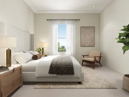 a bedroom with a bed and a couch