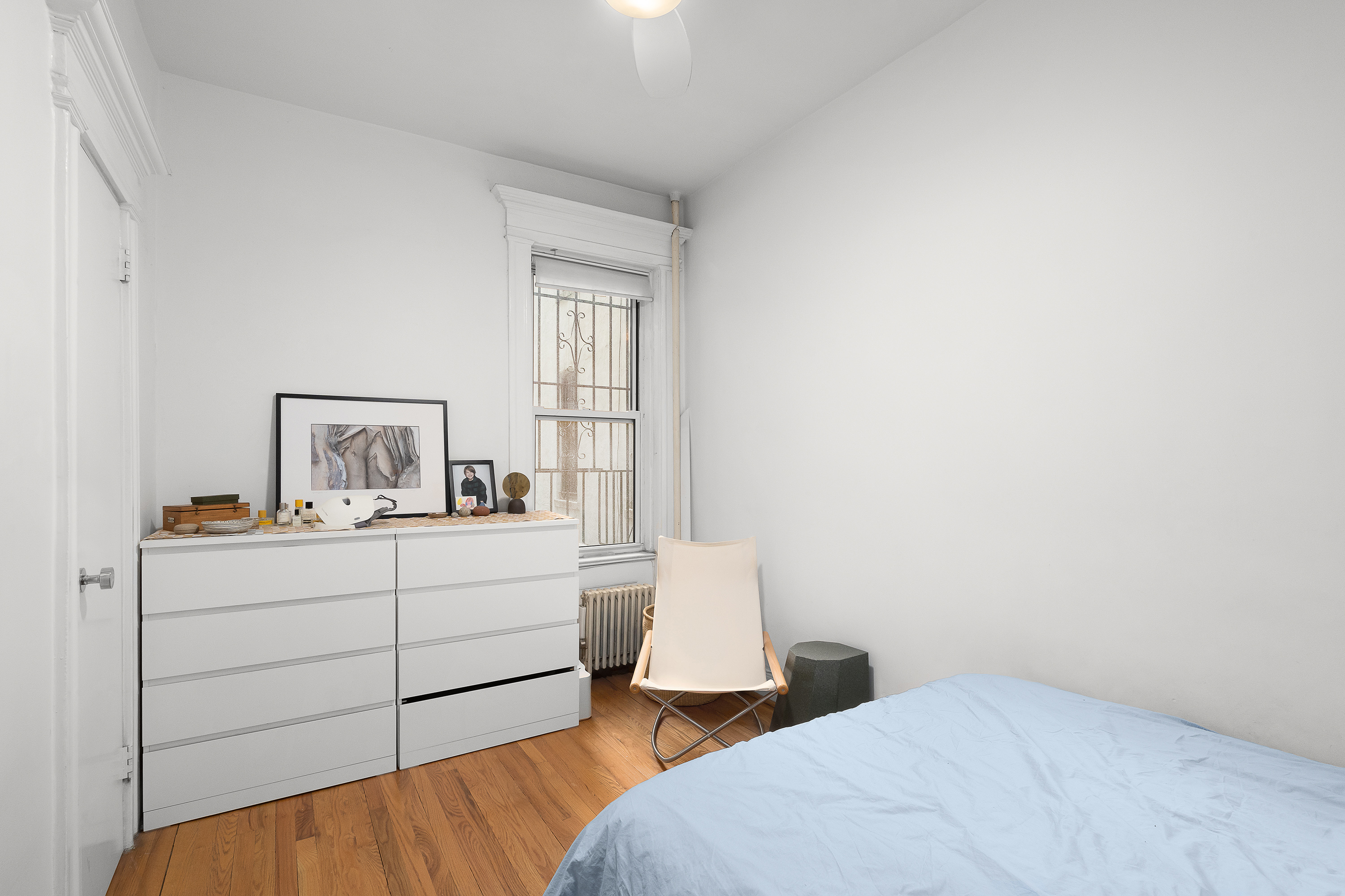 226 St James Place, Unit 1R Brooklyn, NY 11238 - Photo 9 of 14 a bedroom with a bed and window