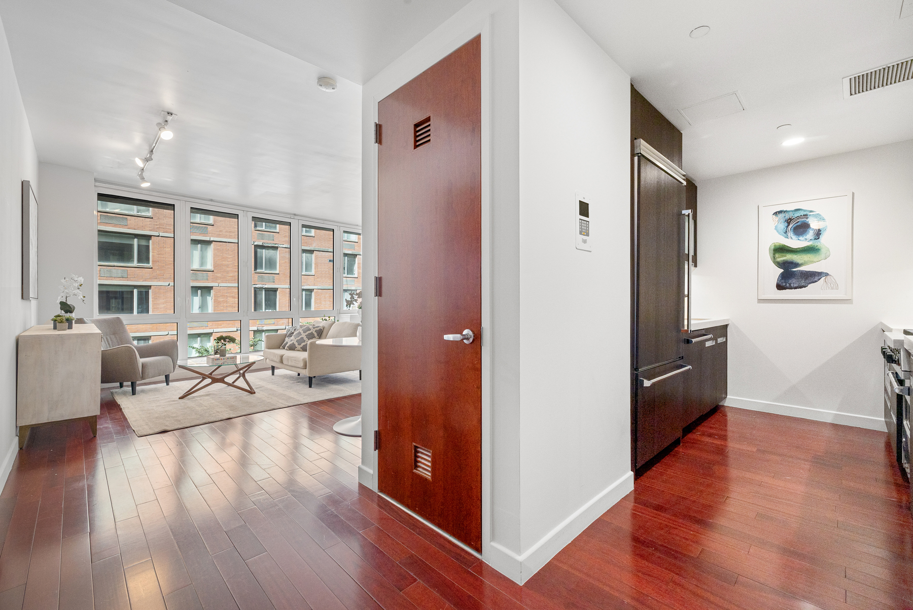 125 West 21st Street, Unit 4C Manhattan, NY 10011 - Photo 6 of 12 a view of a living room and dining room