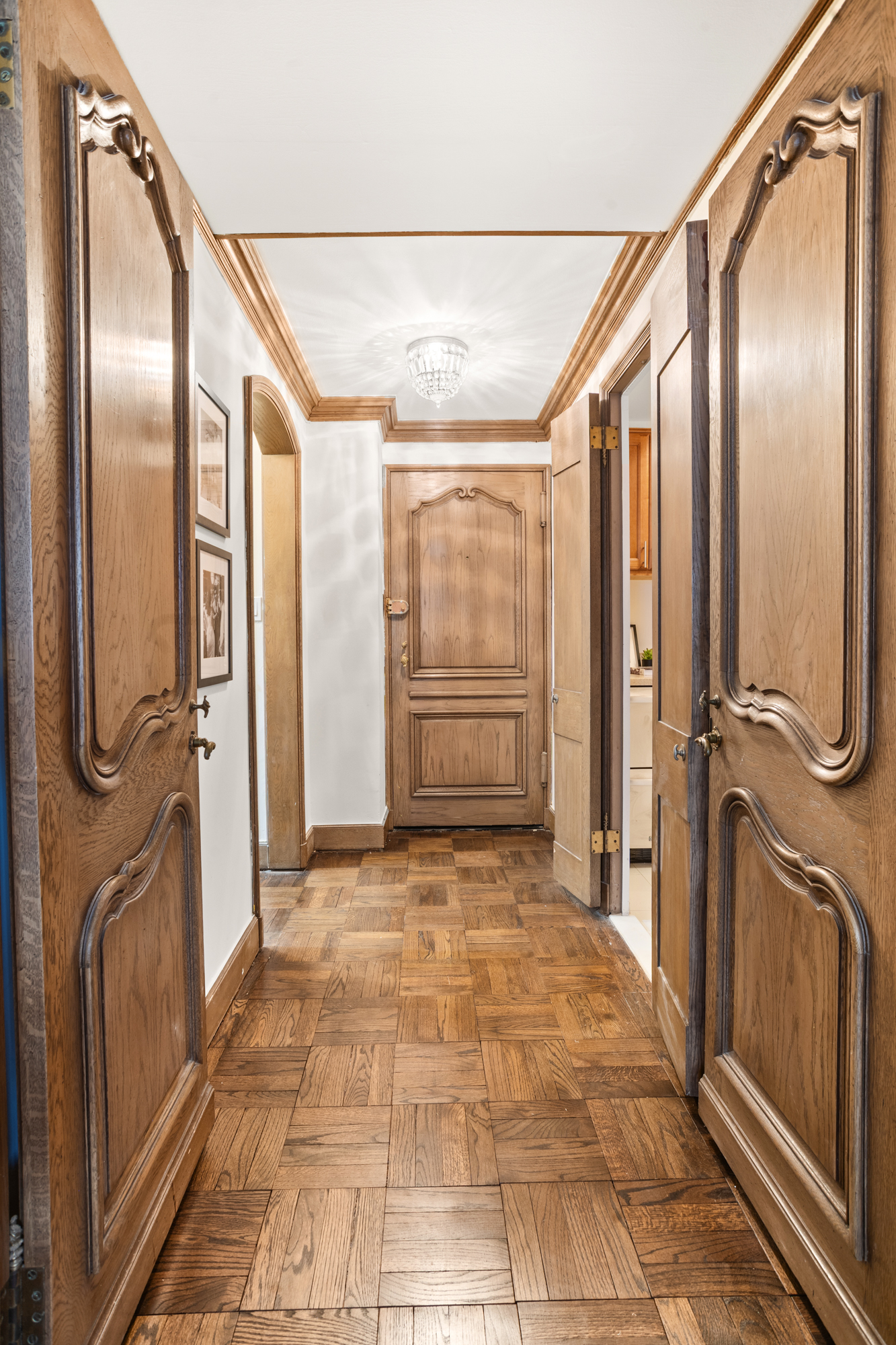 110 East 57th Street, Unit 16B Manhattan, NY 10022 - Photo 10 of 15 a bathroom with a glass door shower and sink