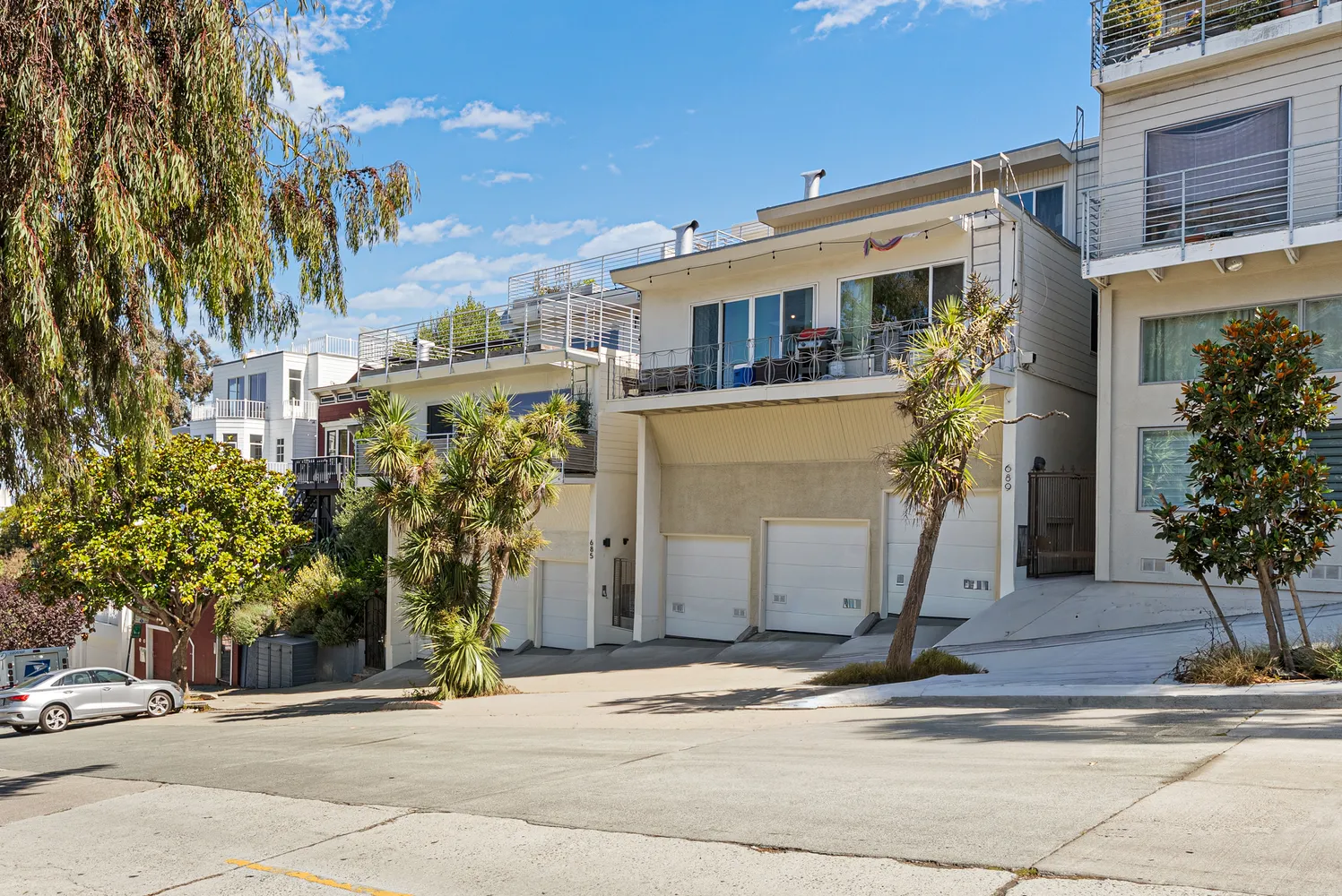 a picture of a room with a black and white kitchen