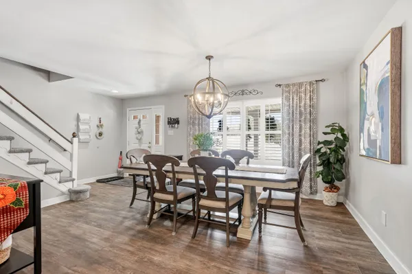 a view of a dining room with furniture window and wooden floor