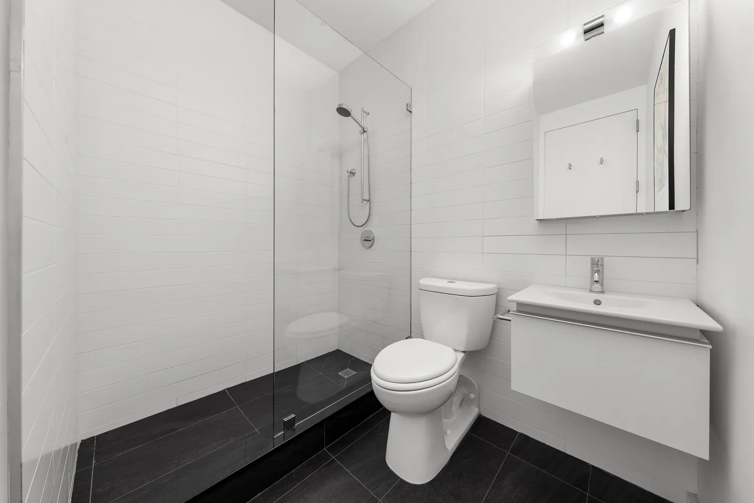 a bathroom with a sink toilet and vanity