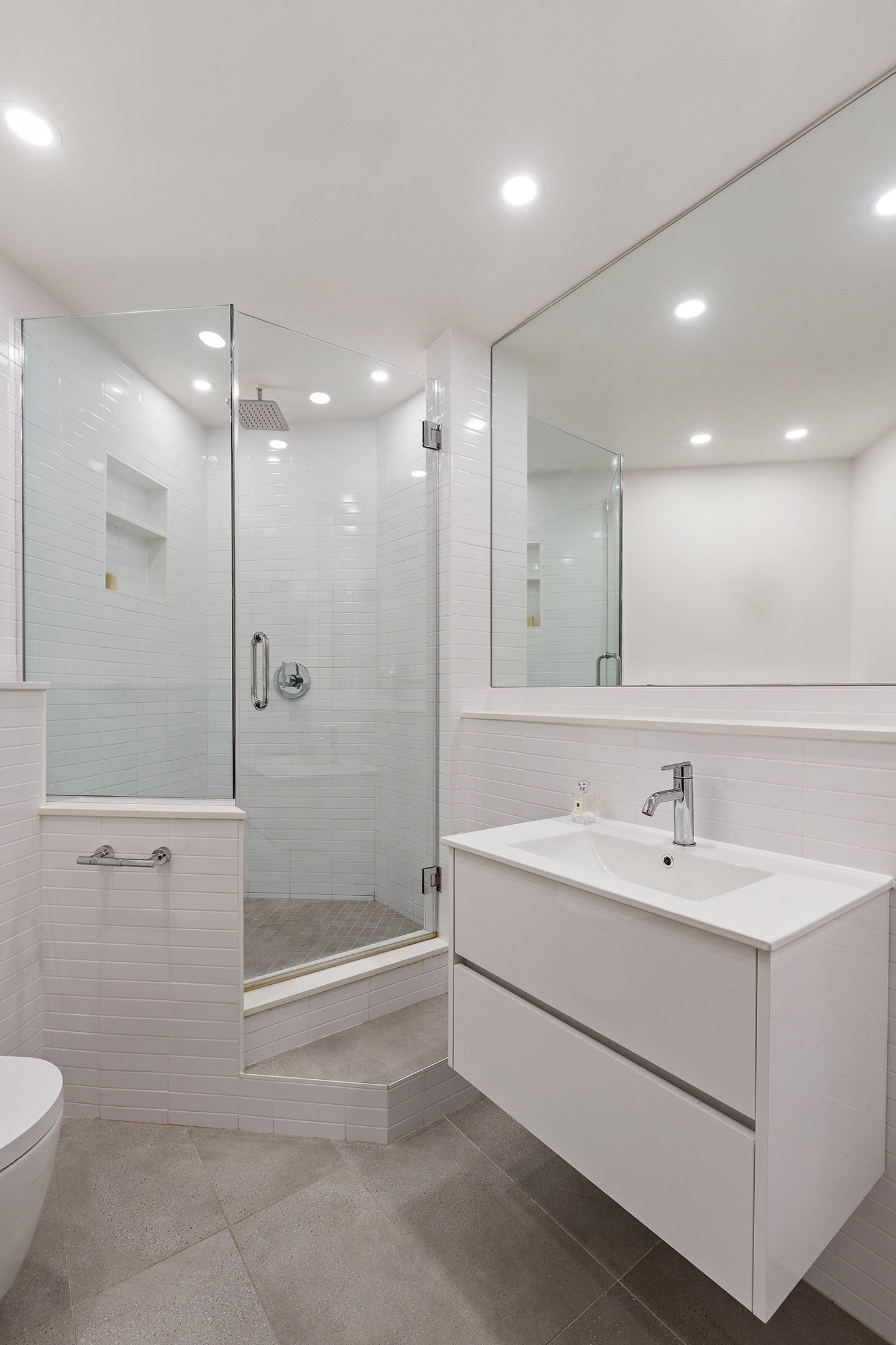 25 West 15th Street, Unit 3 Manhattan, NY 10011 - Photo 16 of 19 a bathroom with a sink a toilet and shower