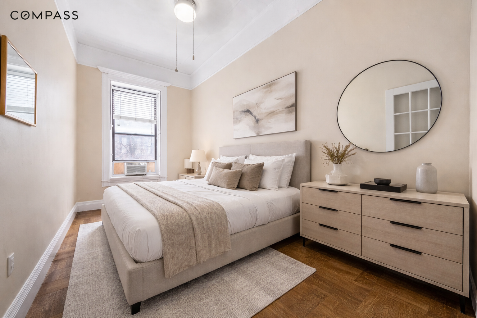 119 West 80th Street, Unit 2F Manhattan, NY 10024 - Photo 3 of 7 a bedroom with bed and a chandelier