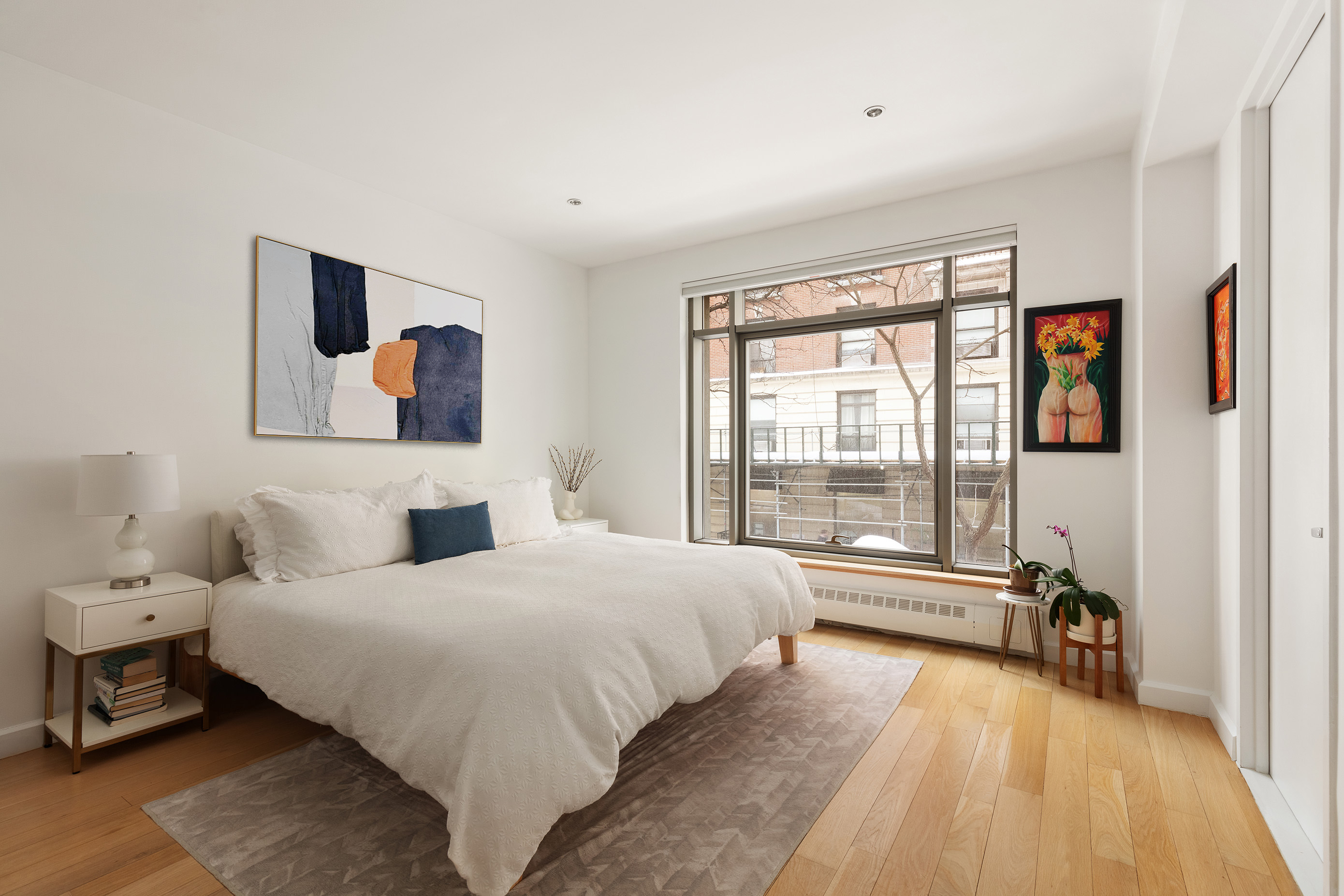 132 East 30th Street, Unit 2 Manhattan, NY 10016 - Photo 5 of 14 a bedroom with a bed and a large window