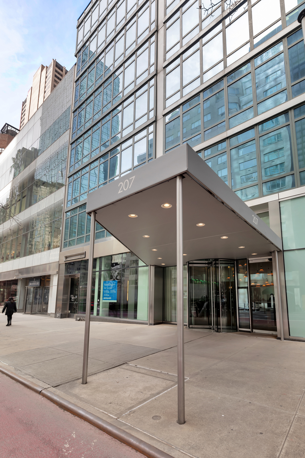 207 East 57th Street, Unit 25B Manhattan, NY 10022 - Photo 18 of 19 a view of a building with a street