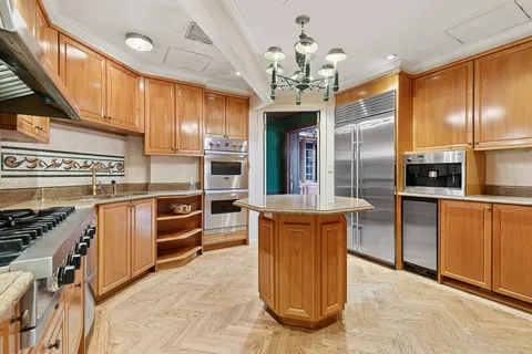 a kitchen with stainless steel appliances granite countertop a sink and cabinets