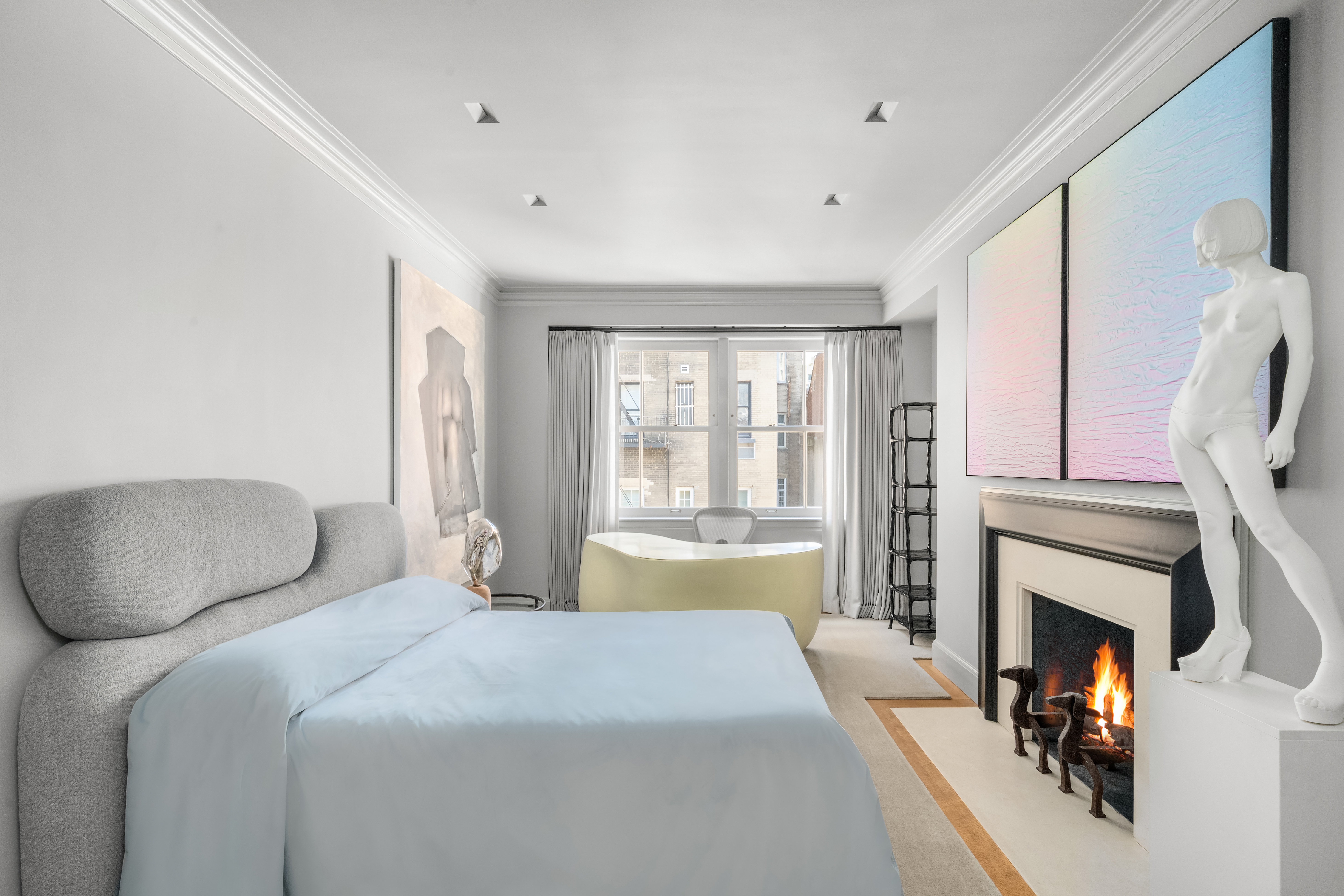 18 East 80th Street Manhattan, NY 10075 - Photo 19 of 28 a bedroom with a bed and a fireplace