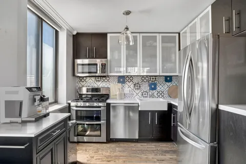 a kitchen with a stove microwave and refrigerator