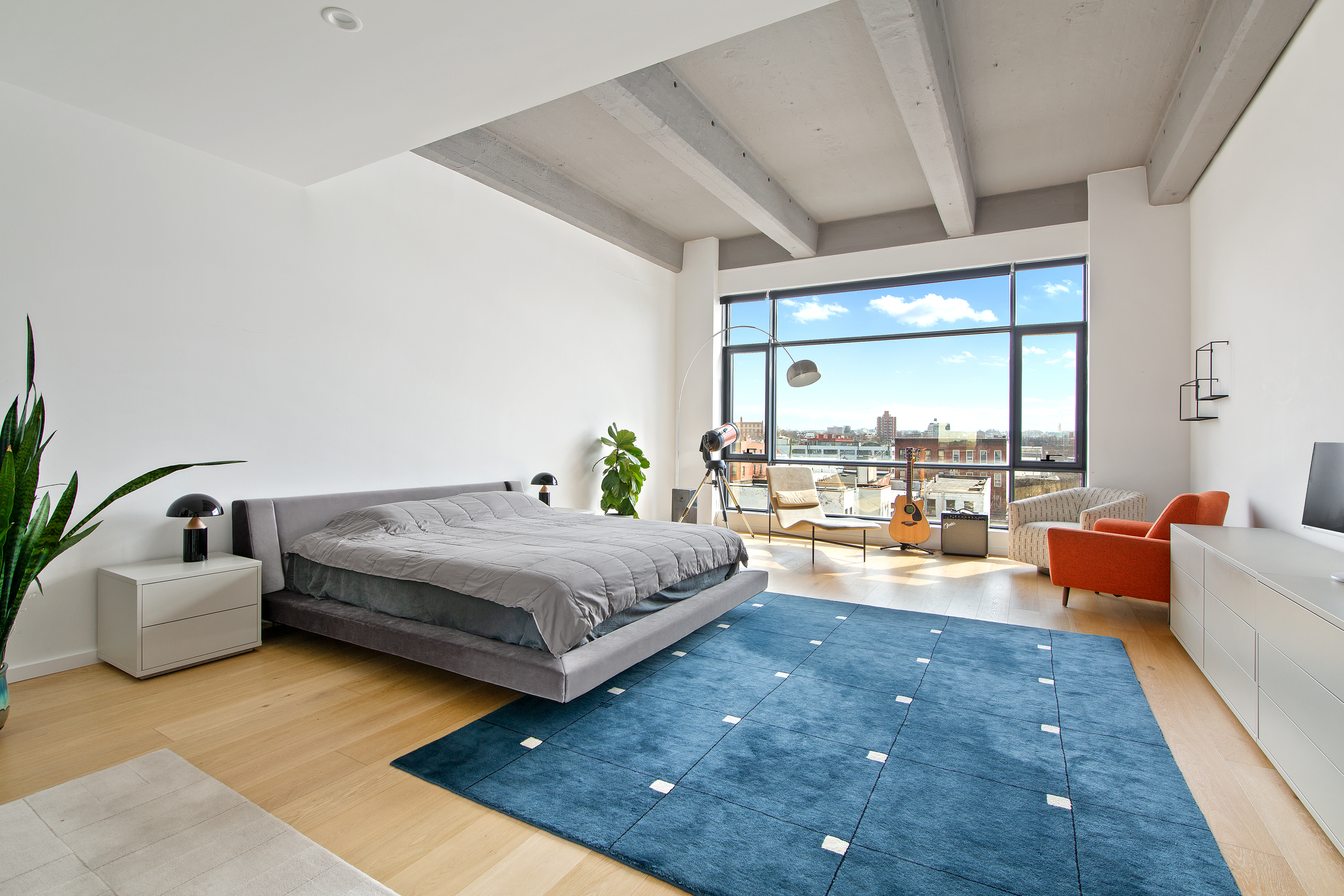 160 Imlay Street, Unit 4E2 Brooklyn, NY 11231 - Photo 2 of 8 a bedroom with furniture and a large window