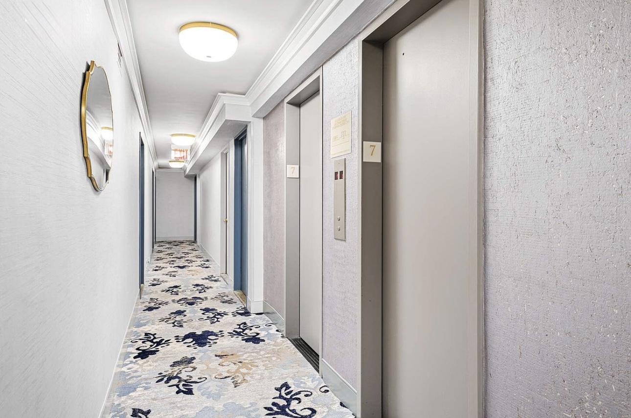 525 East 82nd Street, Unit 12E Manhattan, NY 10028 - Photo 23 of 29 a view of a hallway with wooden floor and entryway