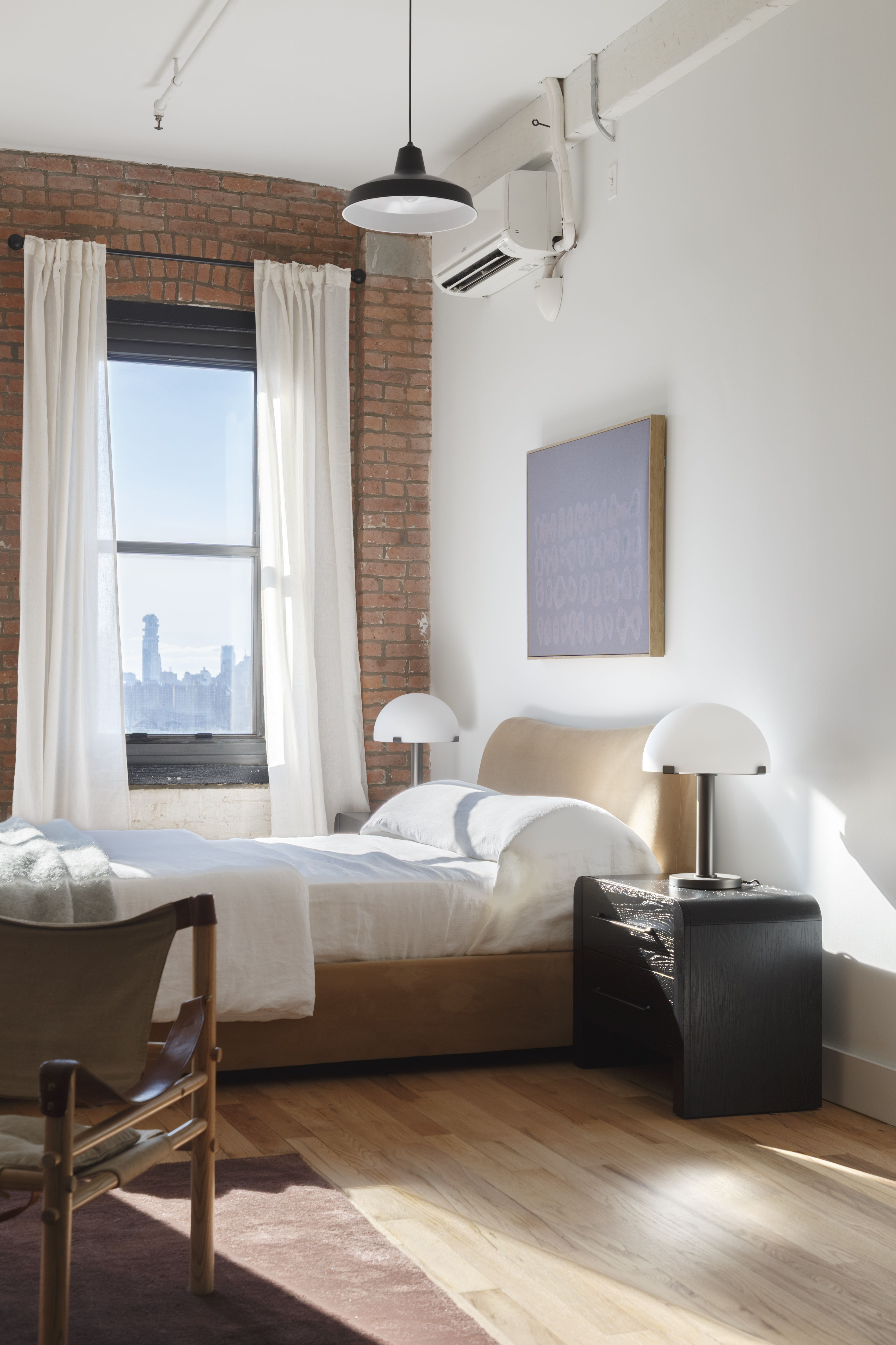 239 Banker Street, Unit 2R Brooklyn, NY 11222 - Photo 3 of 13 a bedroom with a bed and a table