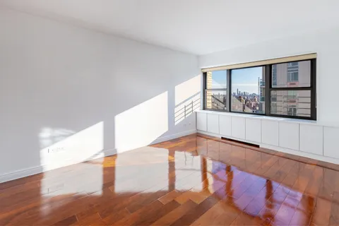 a view of an entryway with wooden floor