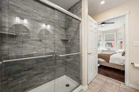 a bathroom with a bathtub and a shower