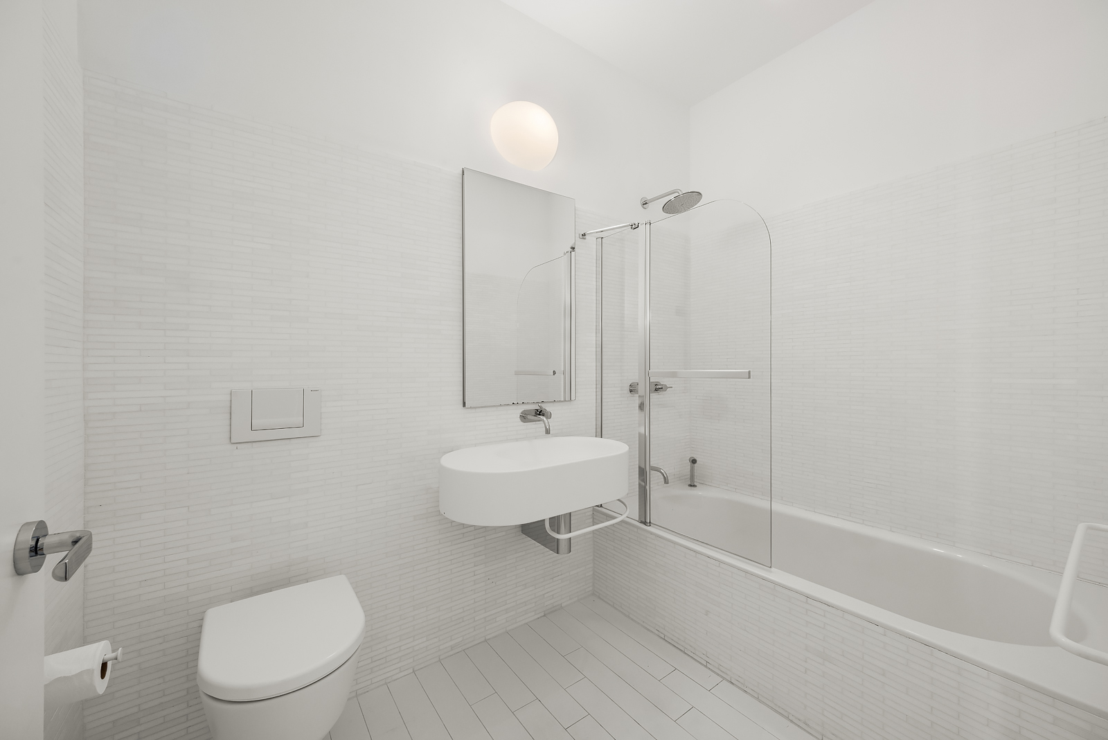 56 Leonard Street, Unit 39BEAST Manhattan, NY 10013 - Photo 16 of 18 a bathroom with a toilet a sink and bathtub