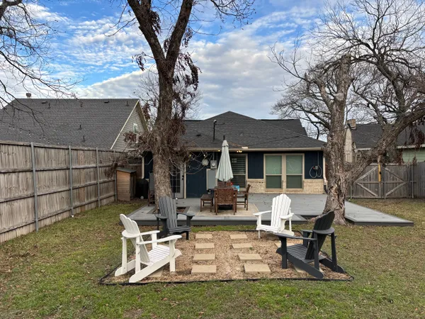 a view of a house with backyard porch and sitting area