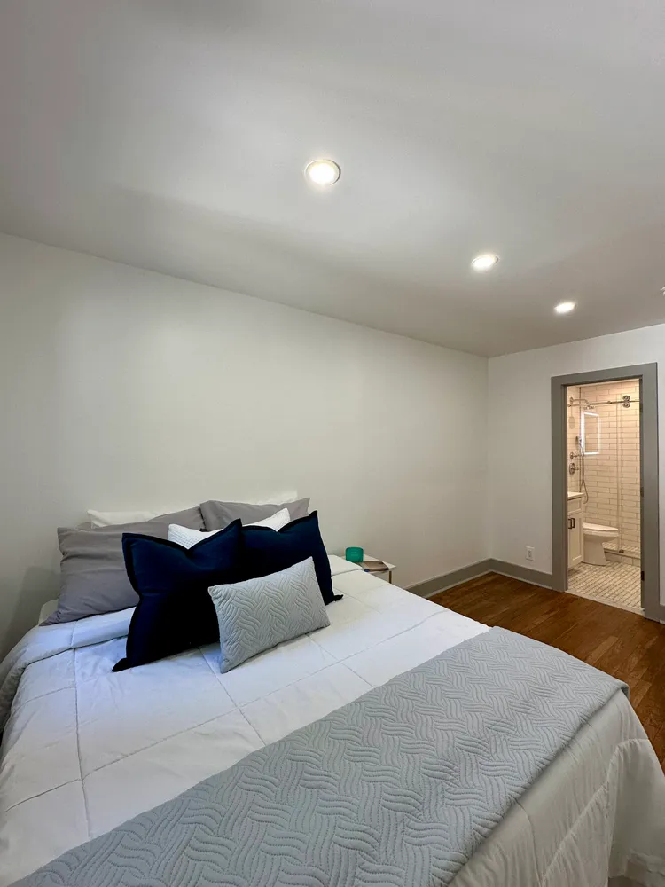 a bedroom with a bed and window