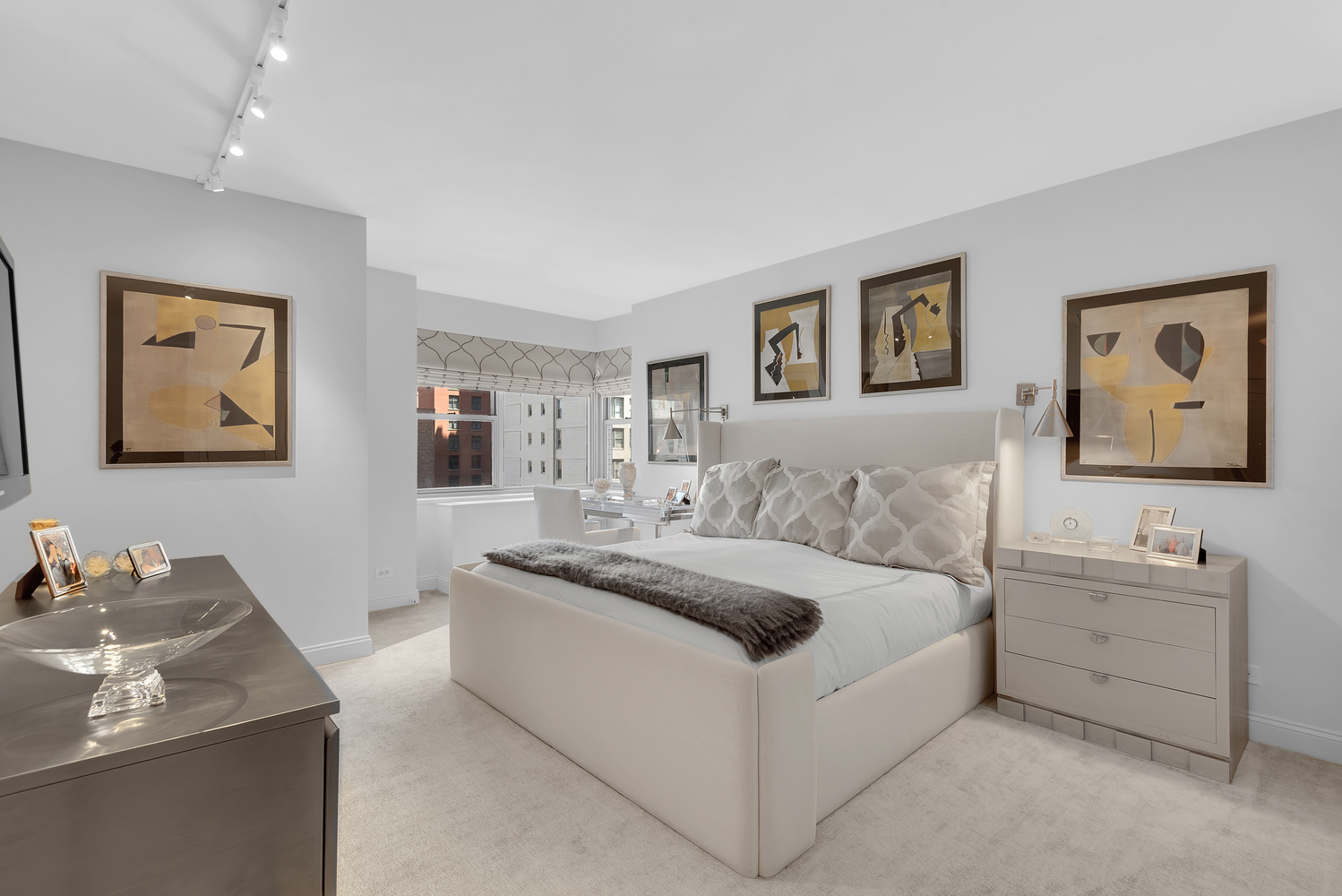 150 East 69th Street, Unit 8J Manhattan, NY 10021 - Photo 6 of 13 a bedroom with a bed and a desk
