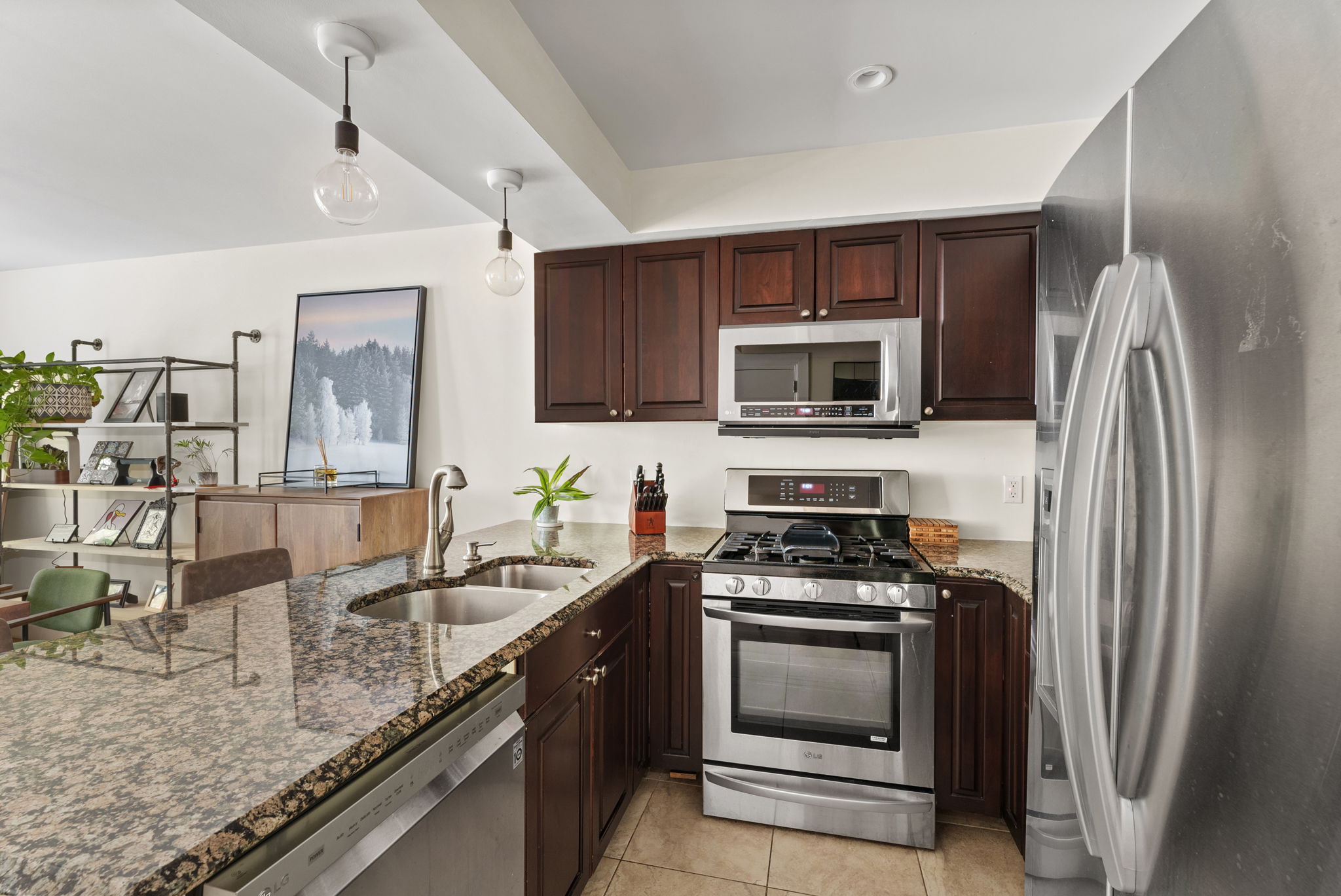 54 State Street, Unit 5 Brooklyn, NY 11201 - Photo 3 of 9 a kitchen with granite countertop a sink stove and refrigerator