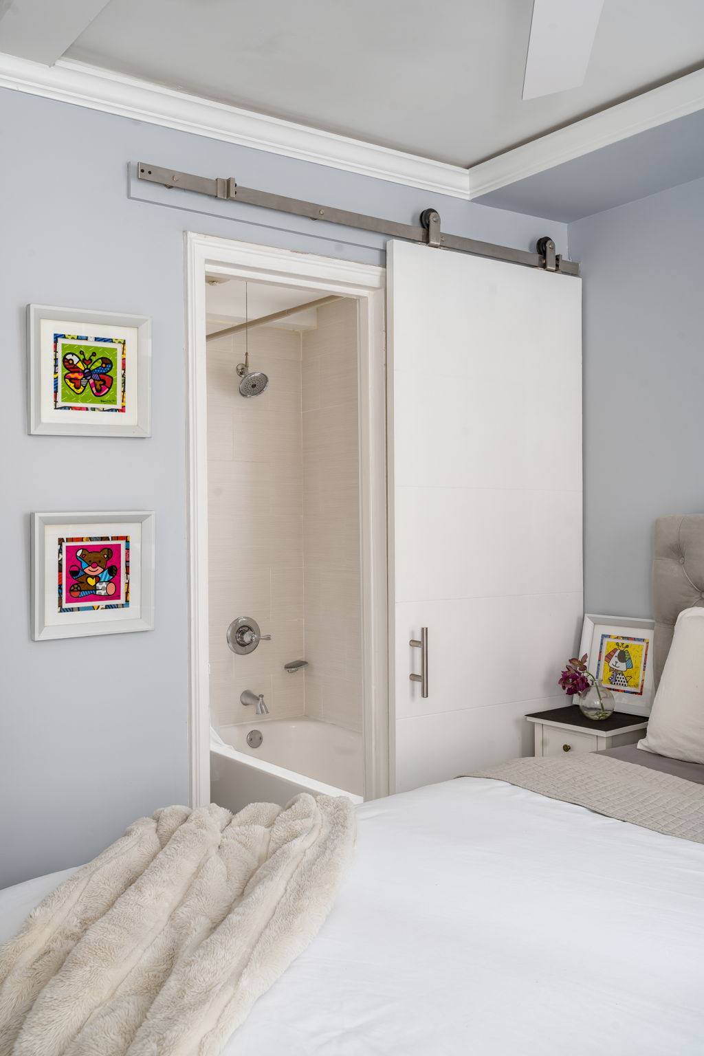 155 East 49th Street, Unit 10E Manhattan, NY 10017 - Photo 9 of 12 a bedroom with a bed and a walk in closet