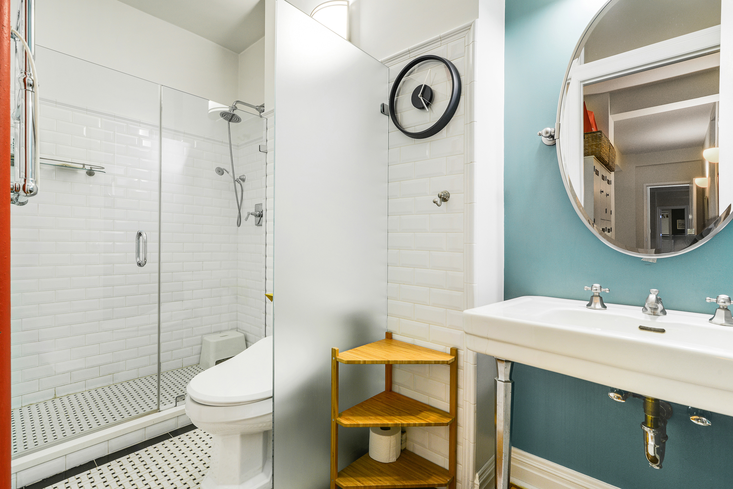 20 West 72nd Street, Unit 601 Manhattan, NY 10023 - Photo 16 of 21 a bathroom with a sink mirror toilet and shower