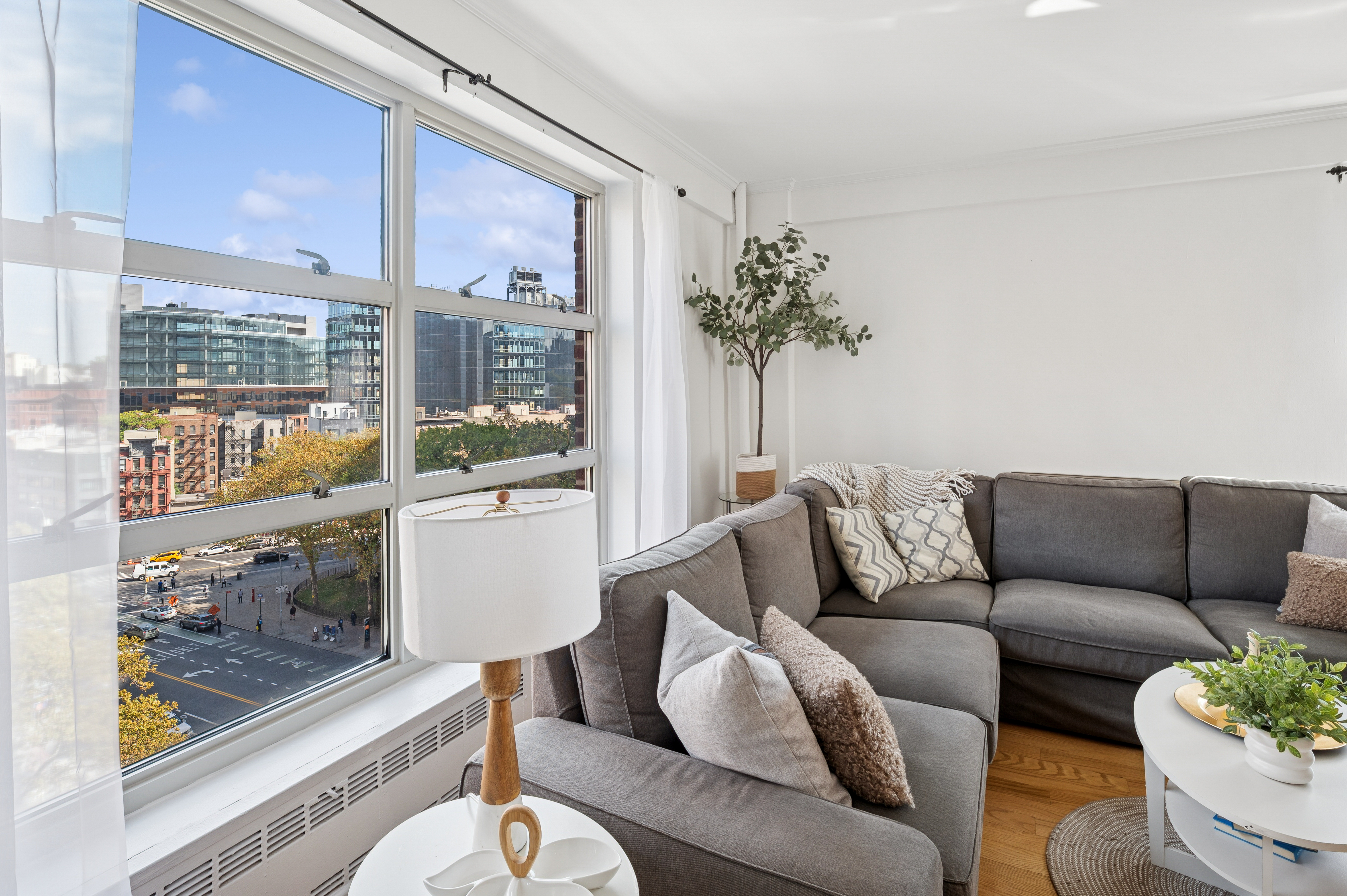 70 La Salle Street, Unit 8C Manhattan, NY 10027 - Photo 3 of 18 a living room with furniture and a large window
