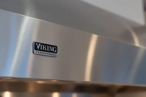 a kitchen with a stove and a table