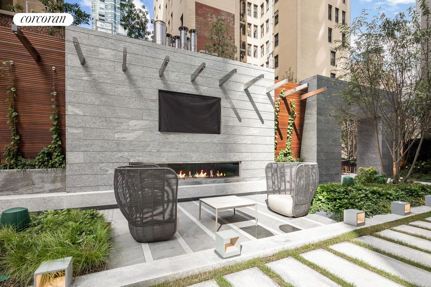 a front view of a house with outdoor seating