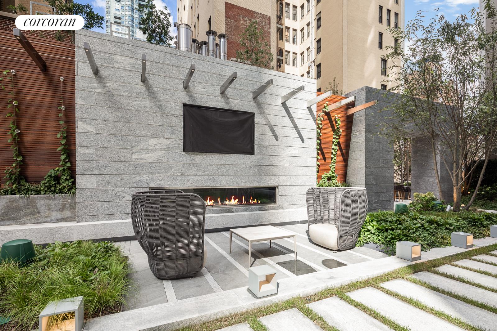 217 West 57th Street, Unit 58W Manhattan, NY 10019 - Photo 19 of 30 a front view of a house with outdoor seating