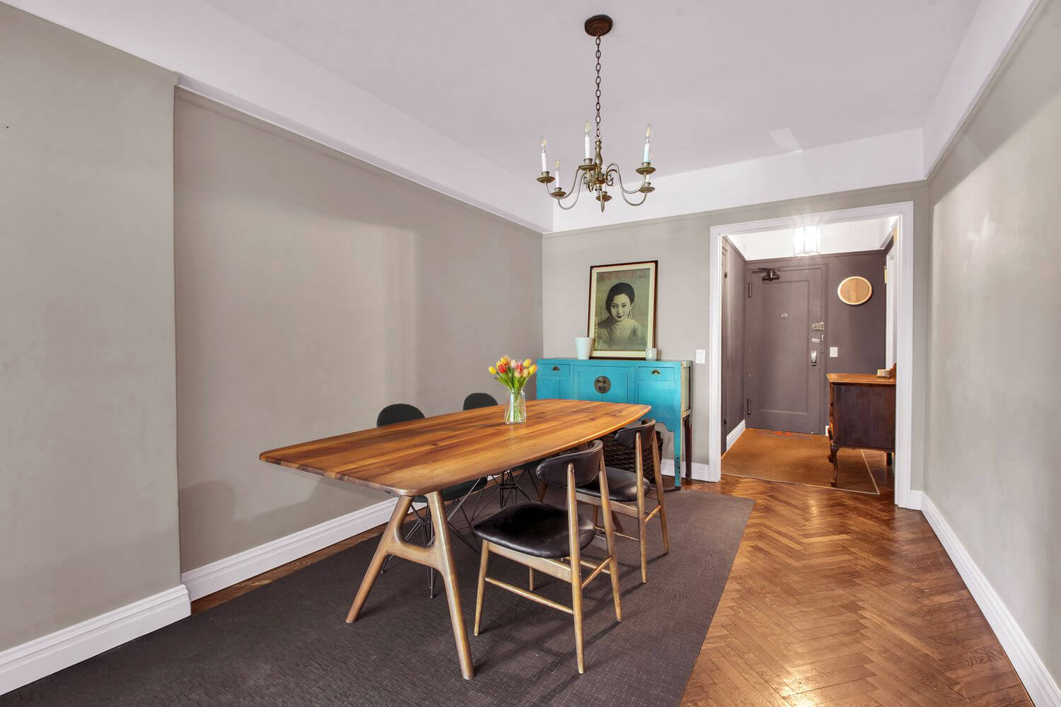 140 Cabrini Boulevard, Unit 14 Manhattan, NY 10033 - Photo 5 of 30 a view of a dining room with furniture and a chandelier